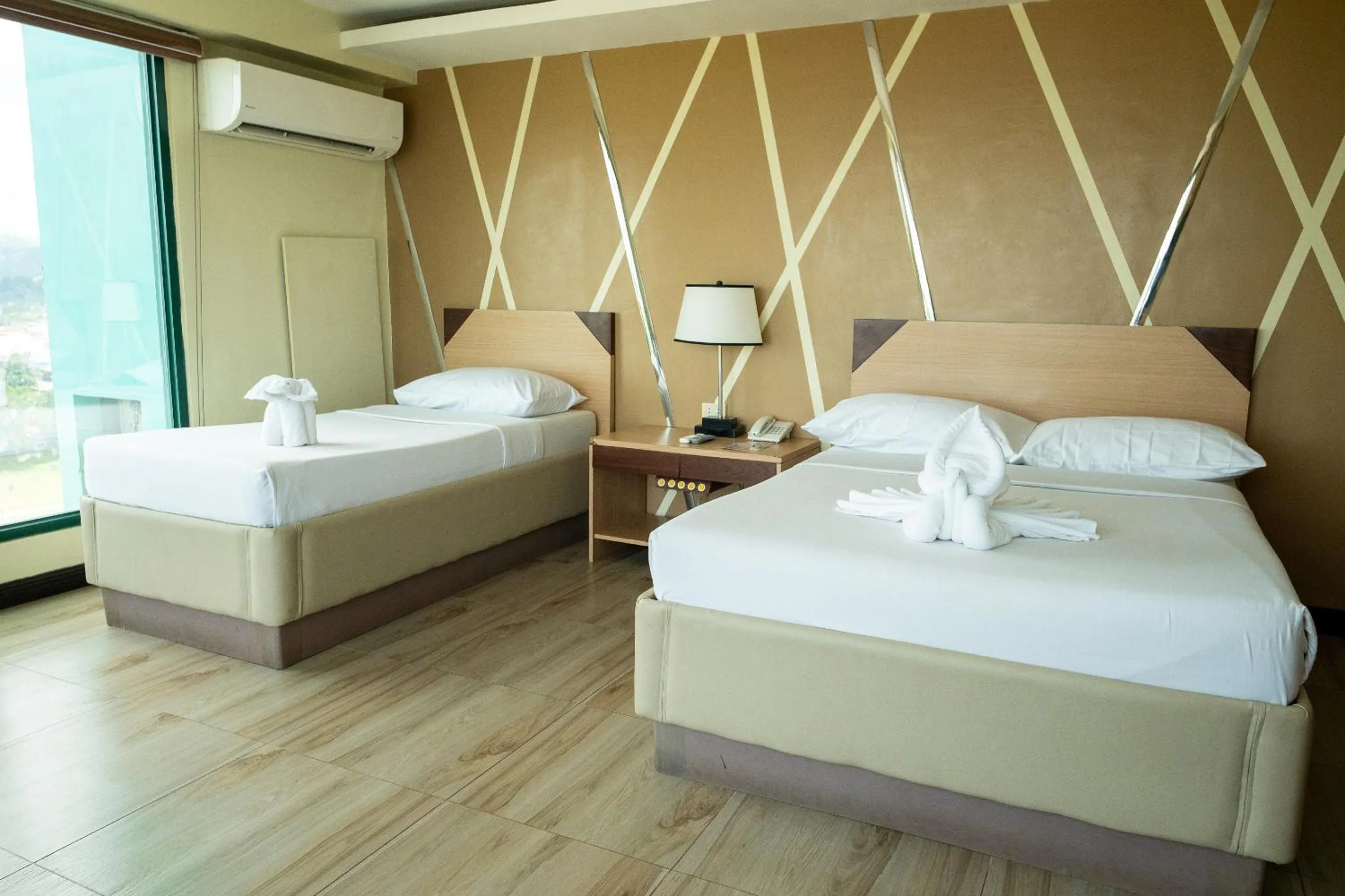 Bed in New Dawn Hotel Plus