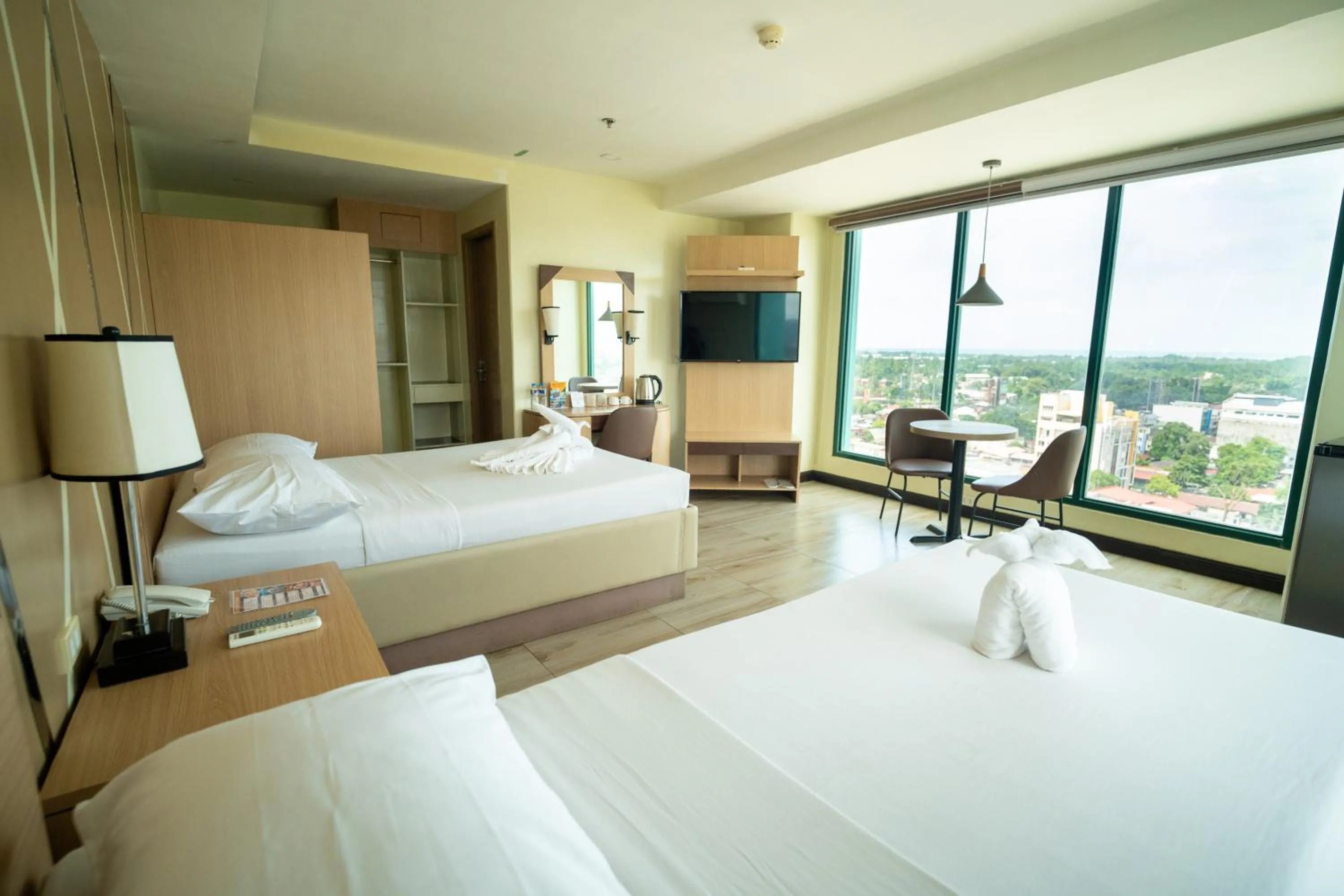 Bed in New Dawn Hotel Plus