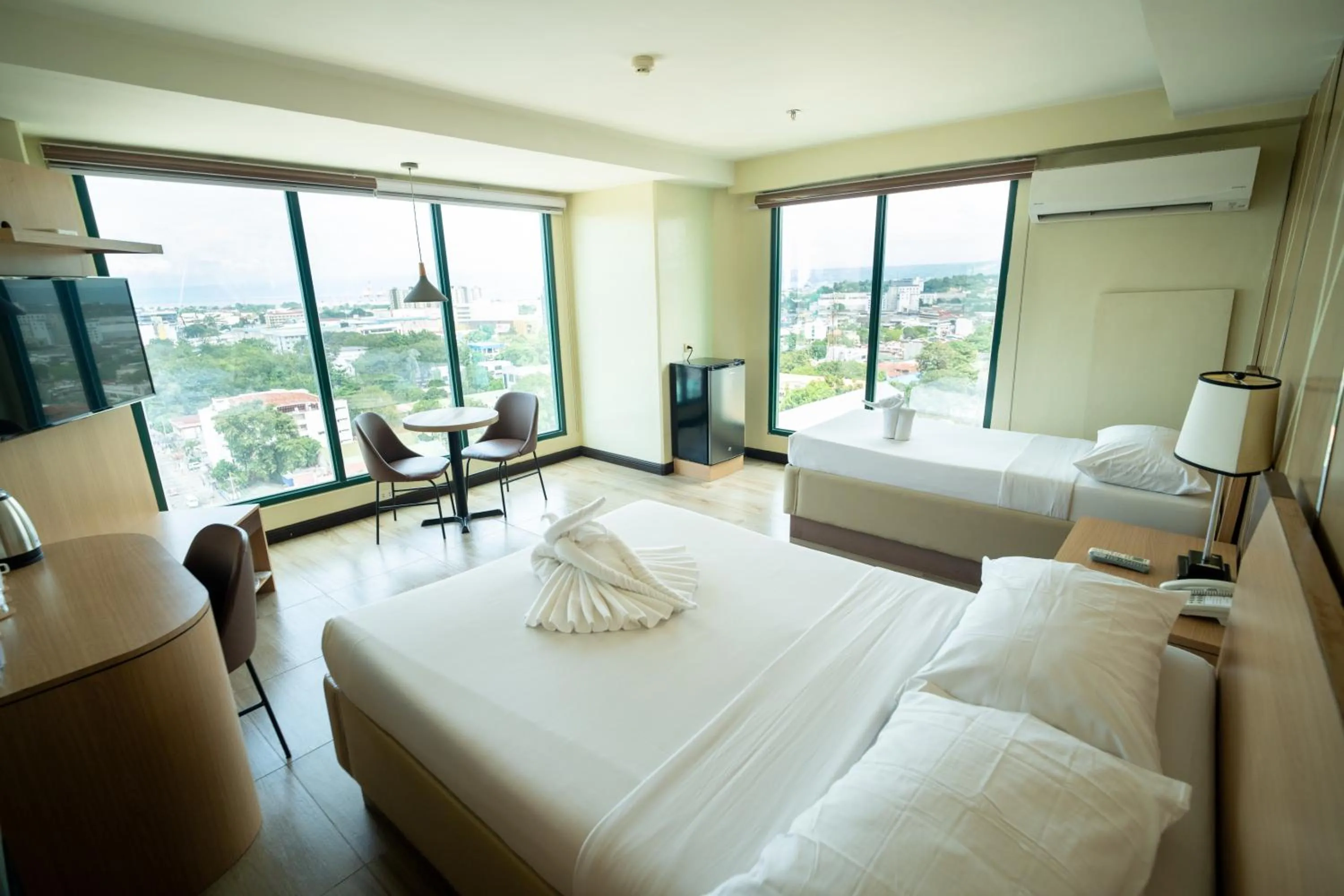 Bed in New Dawn Hotel Plus