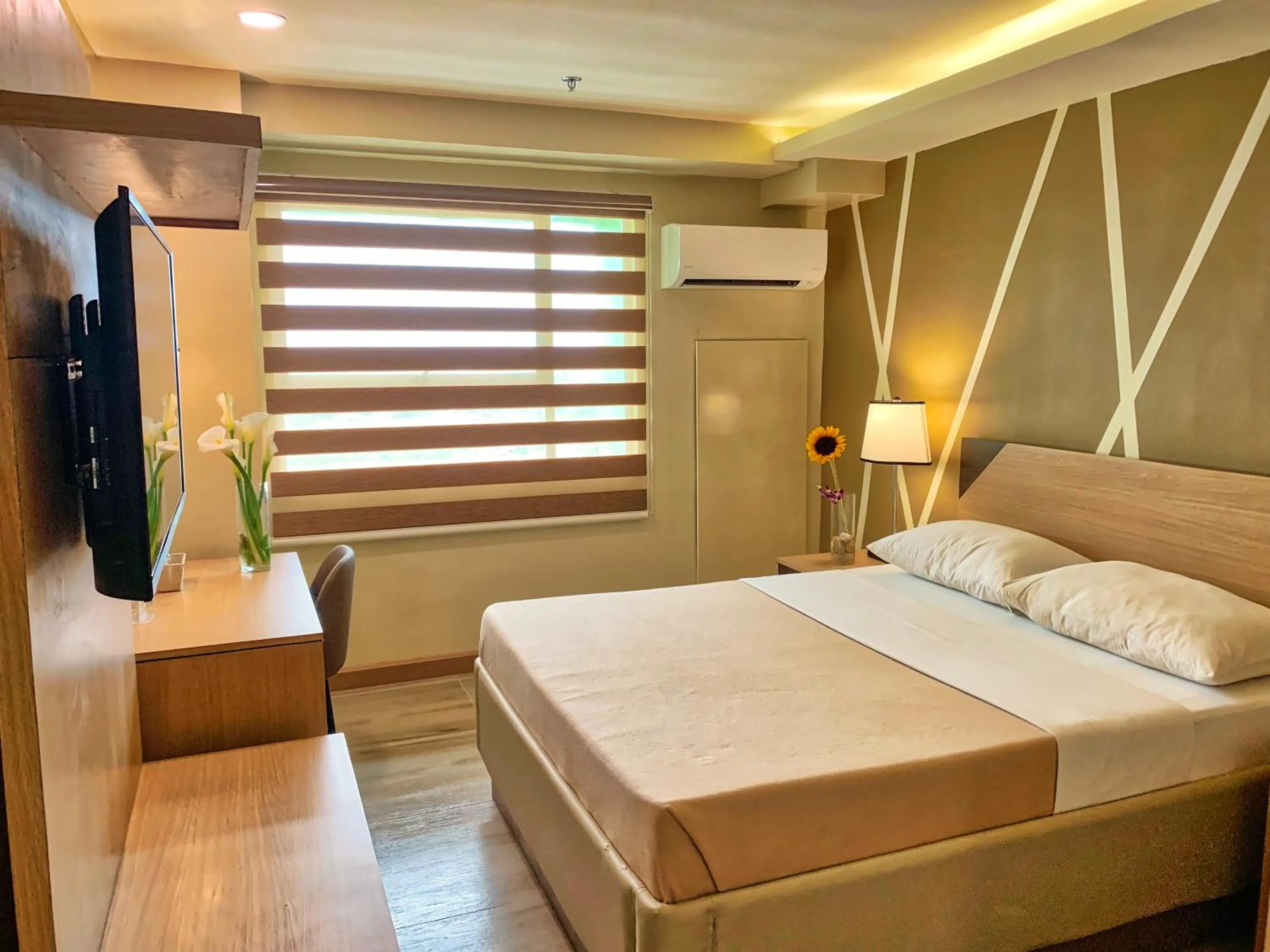 Bed in New Dawn Hotel Plus