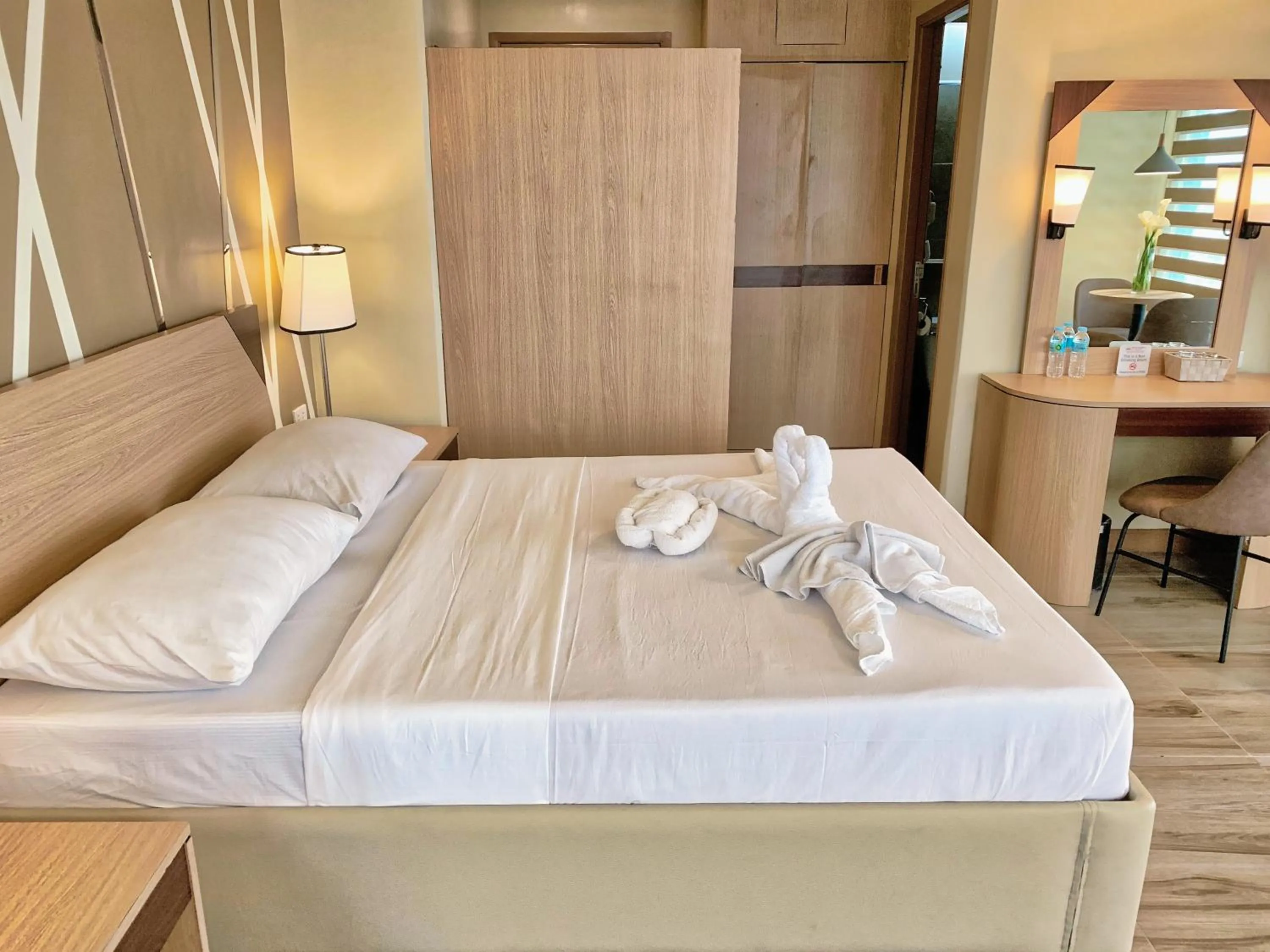 Bed in New Dawn Hotel Plus