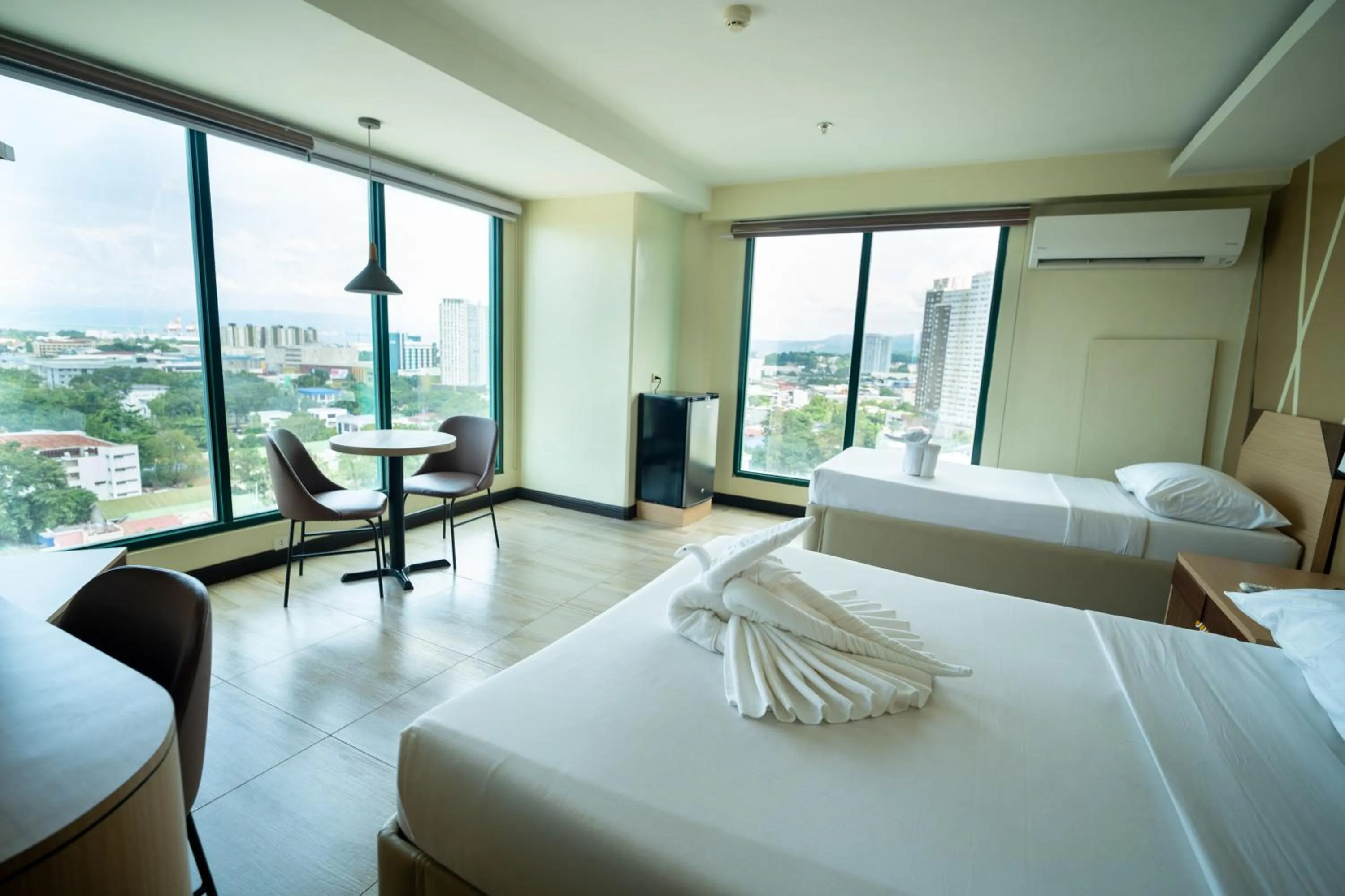 Bed in New Dawn Hotel Plus