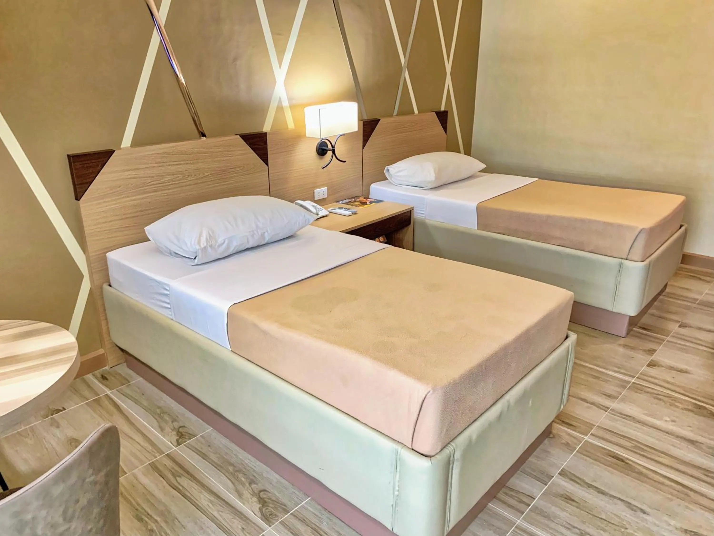 Bed in New Dawn Hotel Plus