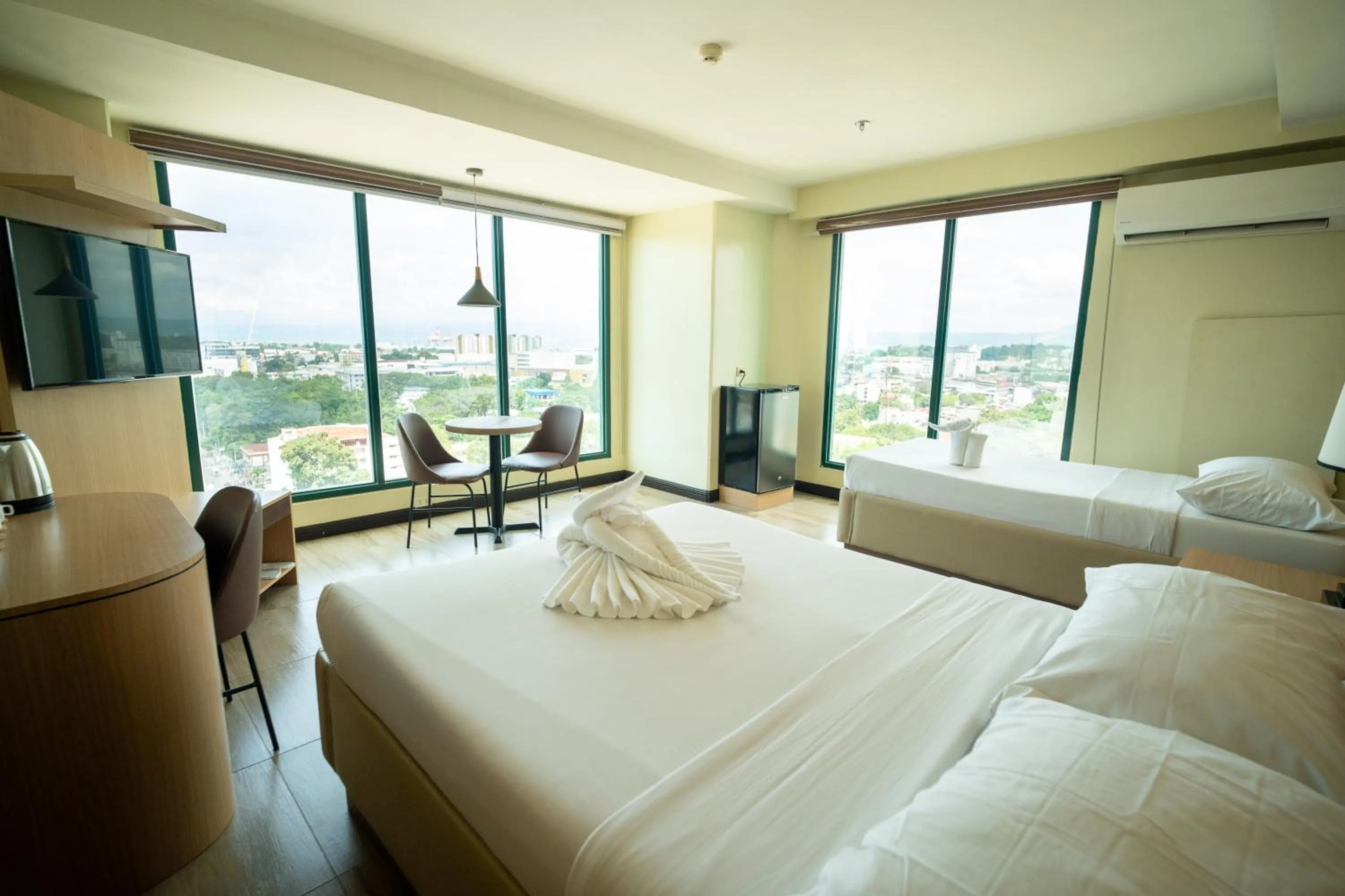 Bed in New Dawn Hotel Plus