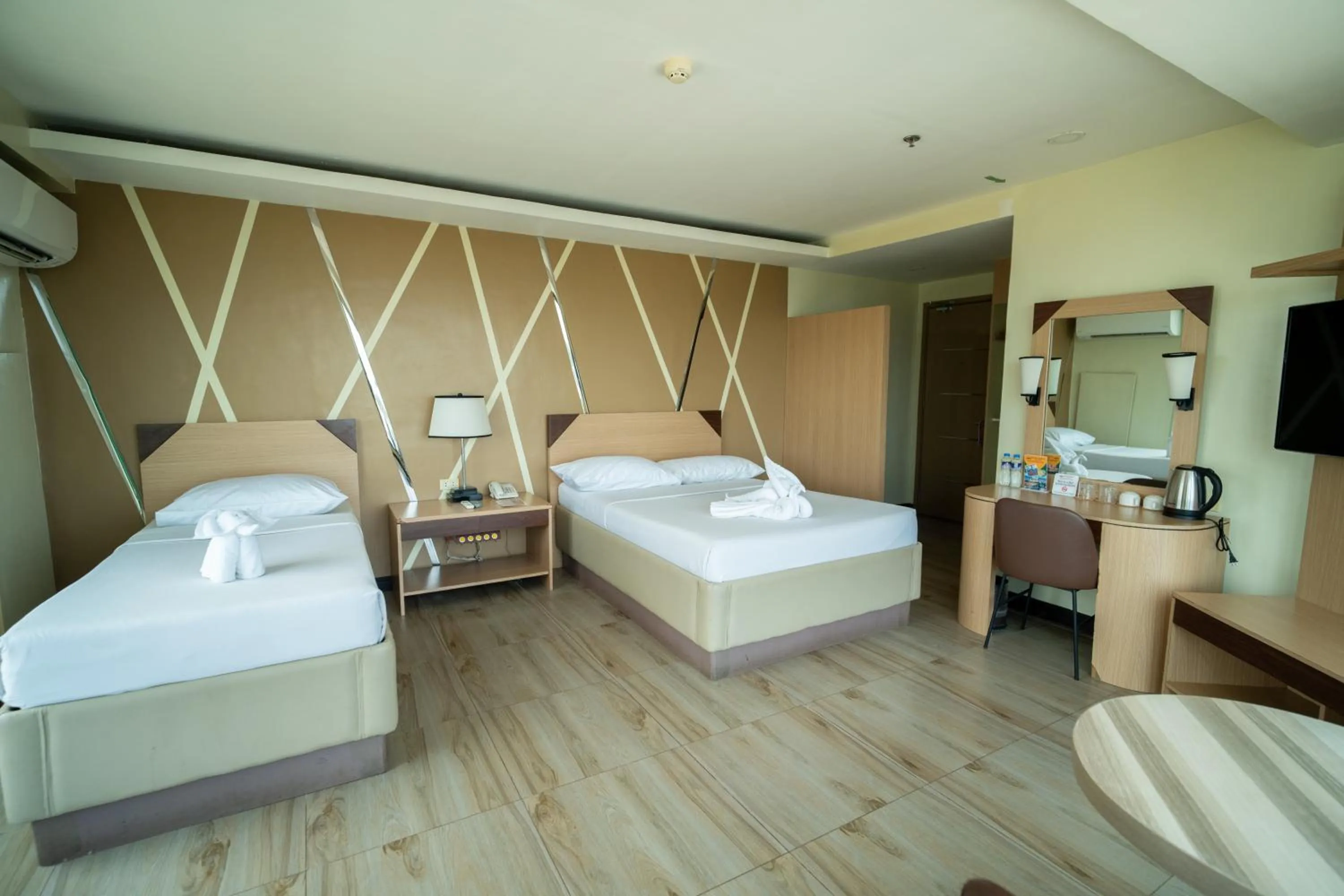 Bed in New Dawn Hotel Plus