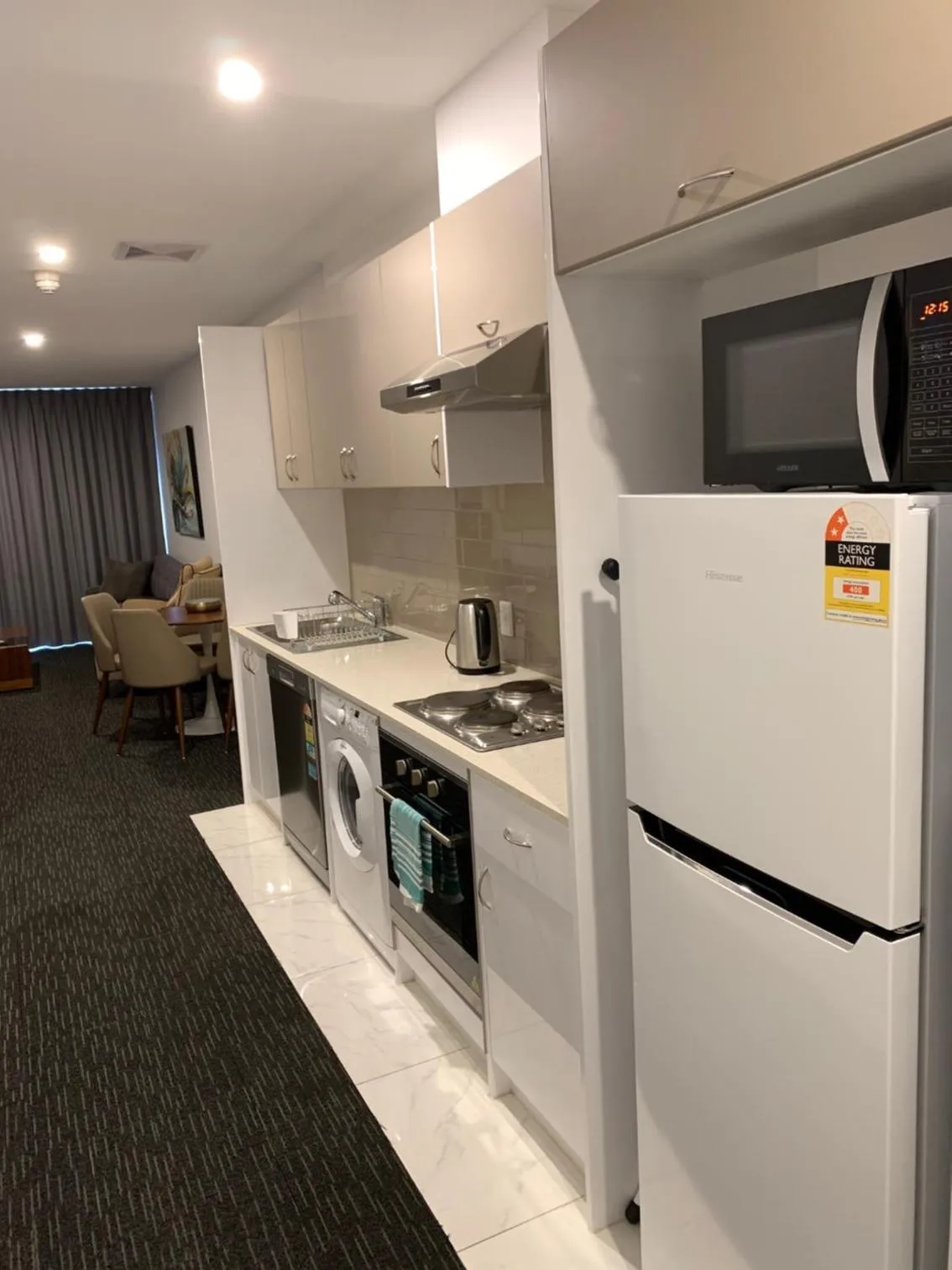 Kitchen or kitchenette in The Palms Apartments