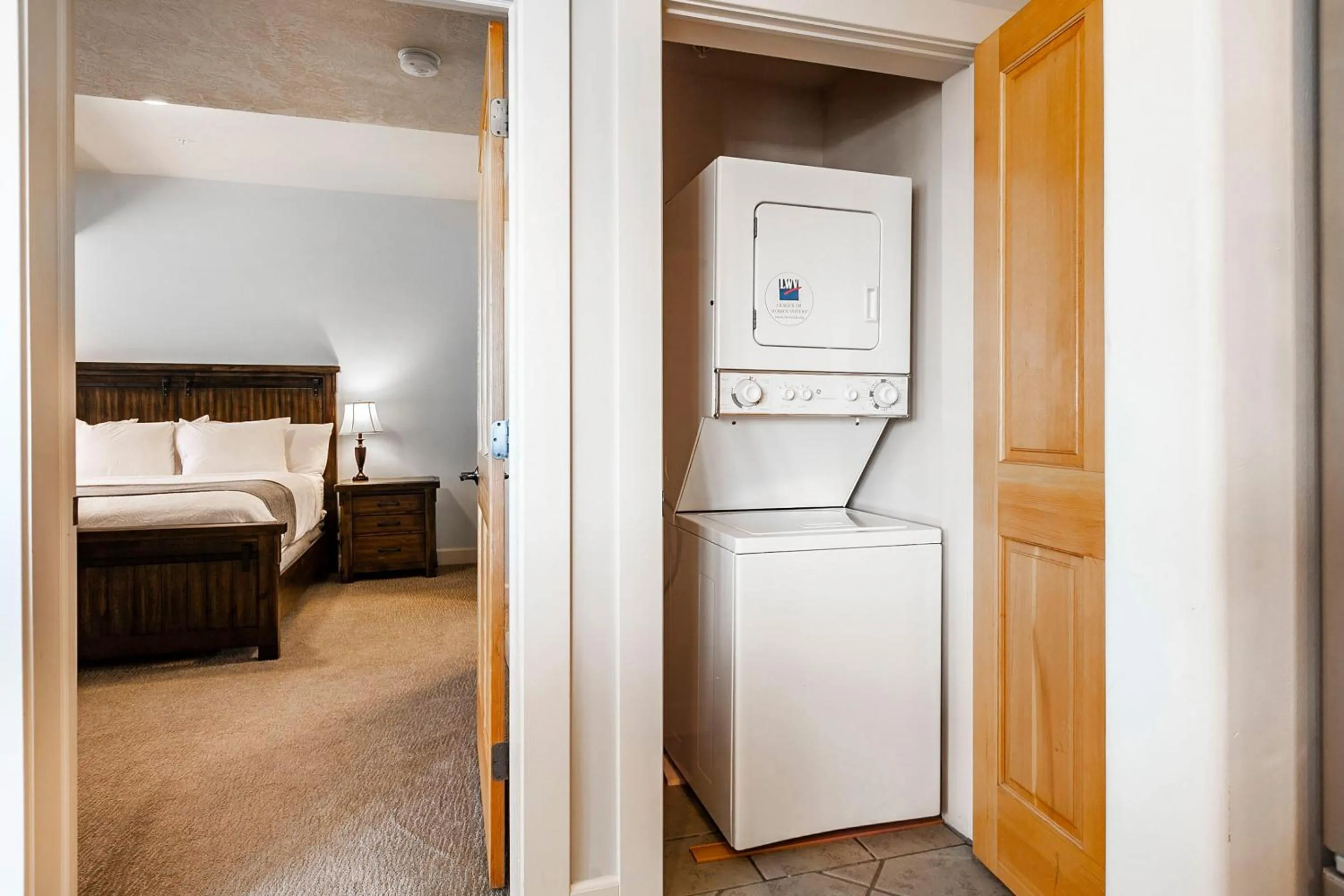 laundry, Bed in Crestview Condominiums by All Seasons Resort Lodging