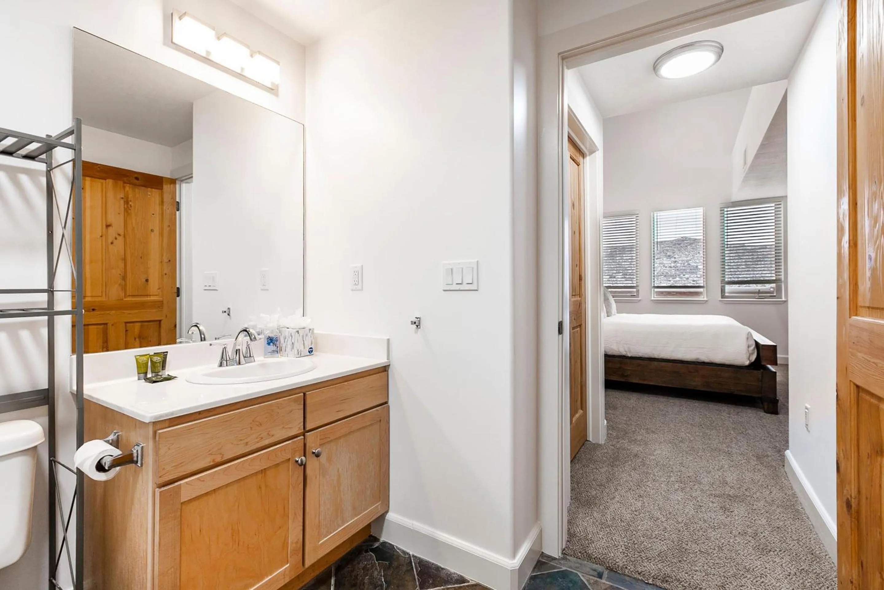 Bathroom, Bed in Crestview Condominiums by All Seasons Resort Lodging