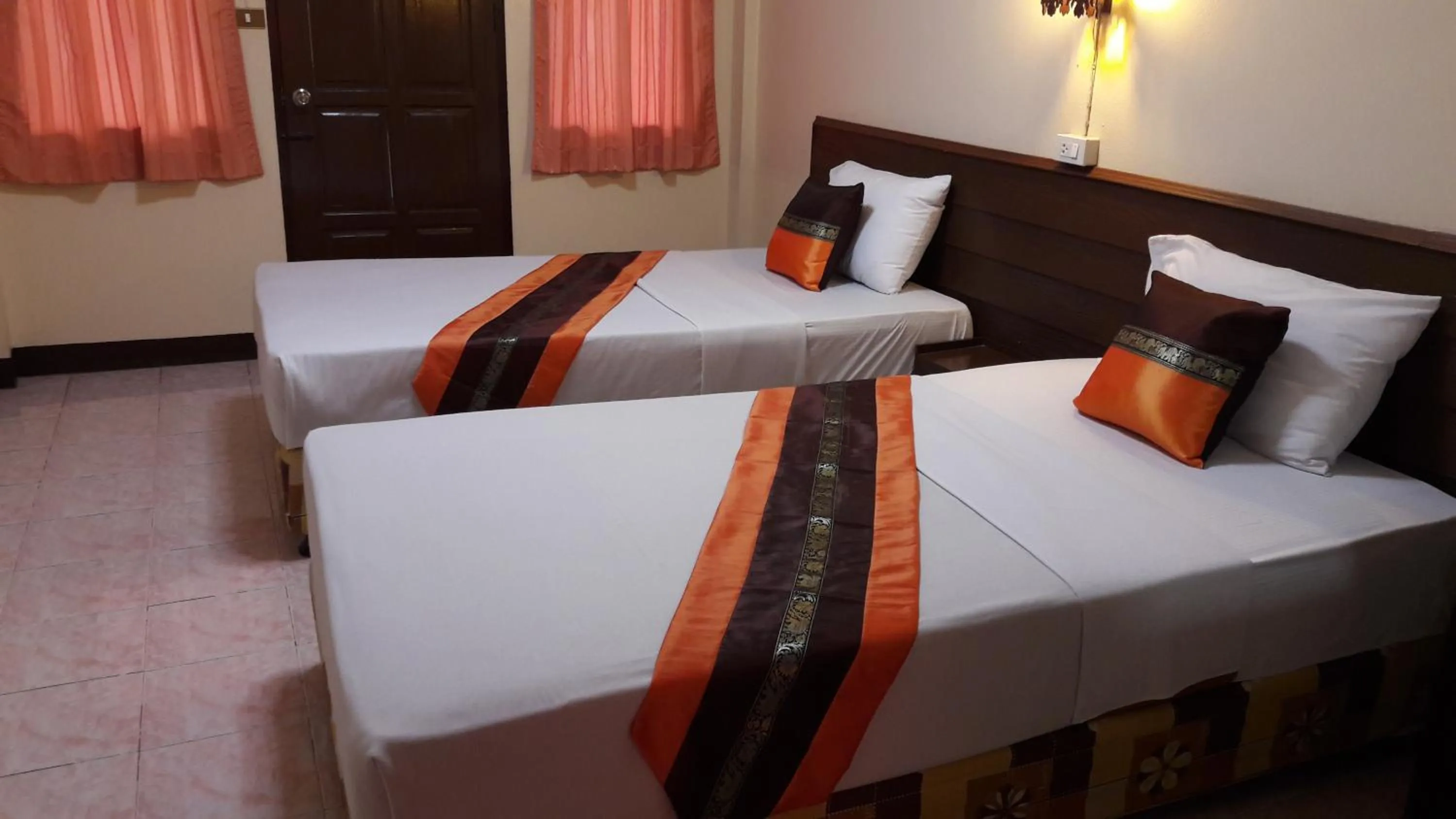 Bed in Lanna Thai Guesthouse