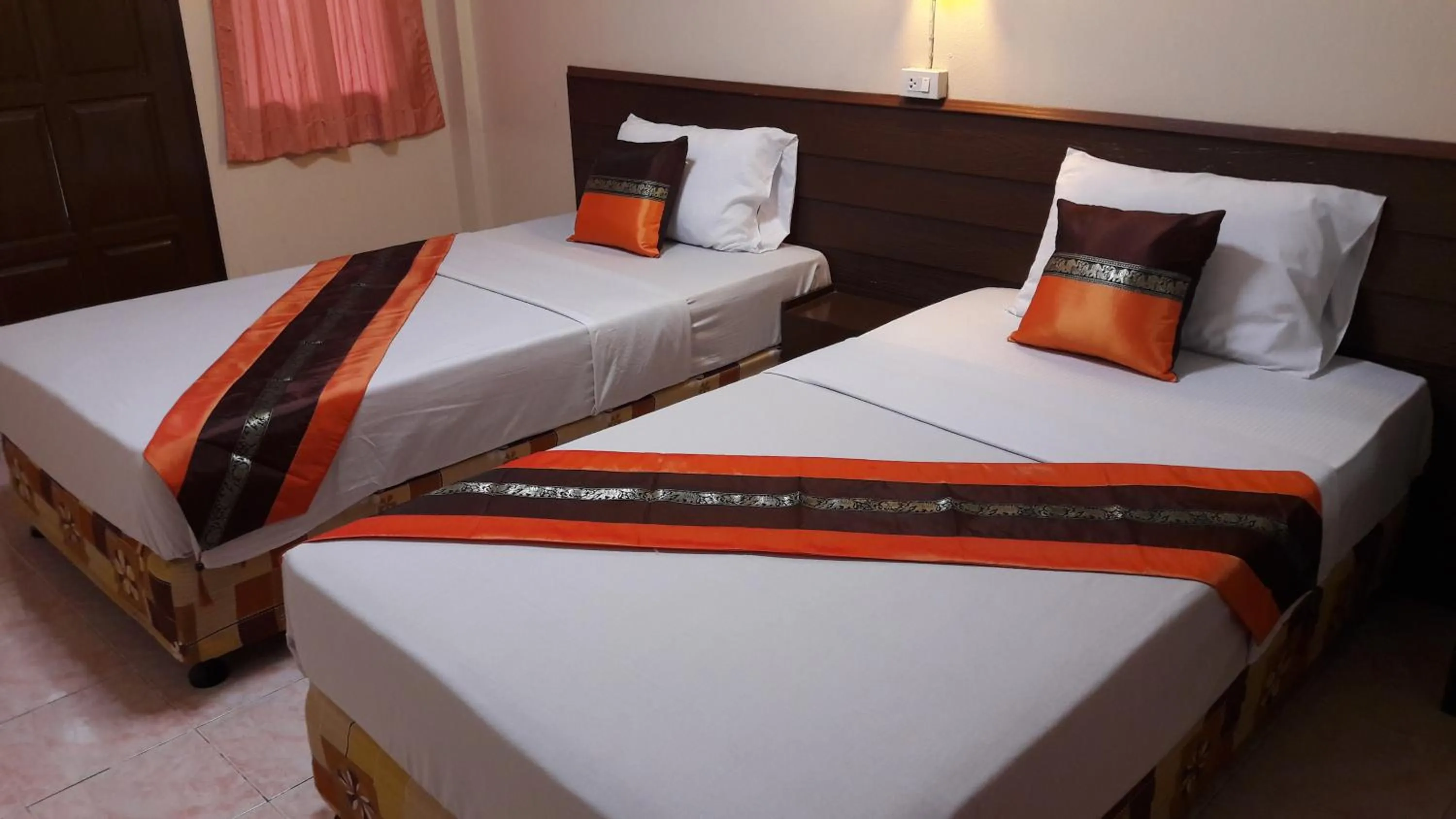 Bed in Lanna Thai Guesthouse