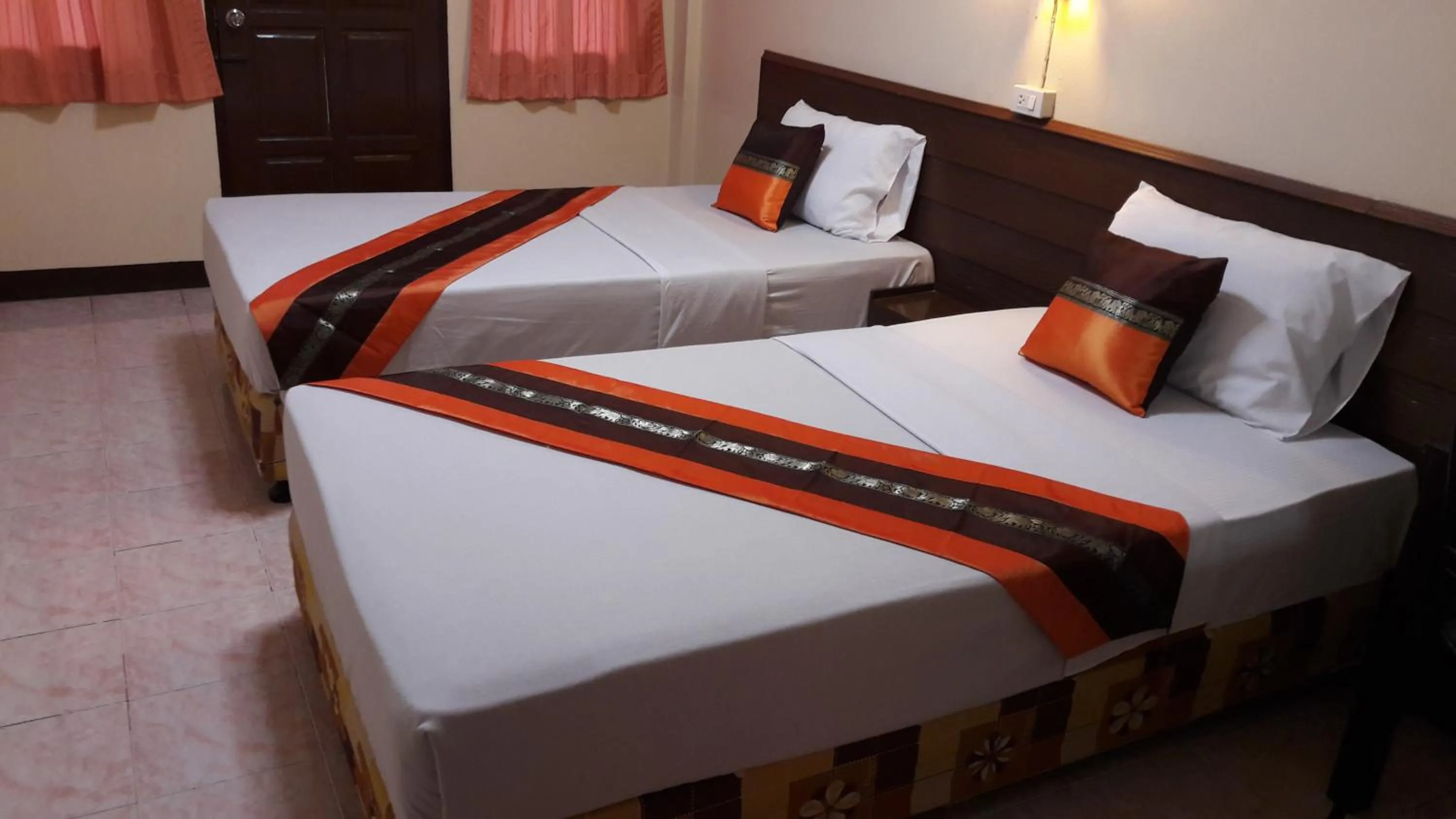 Bed in Lanna Thai Guesthouse