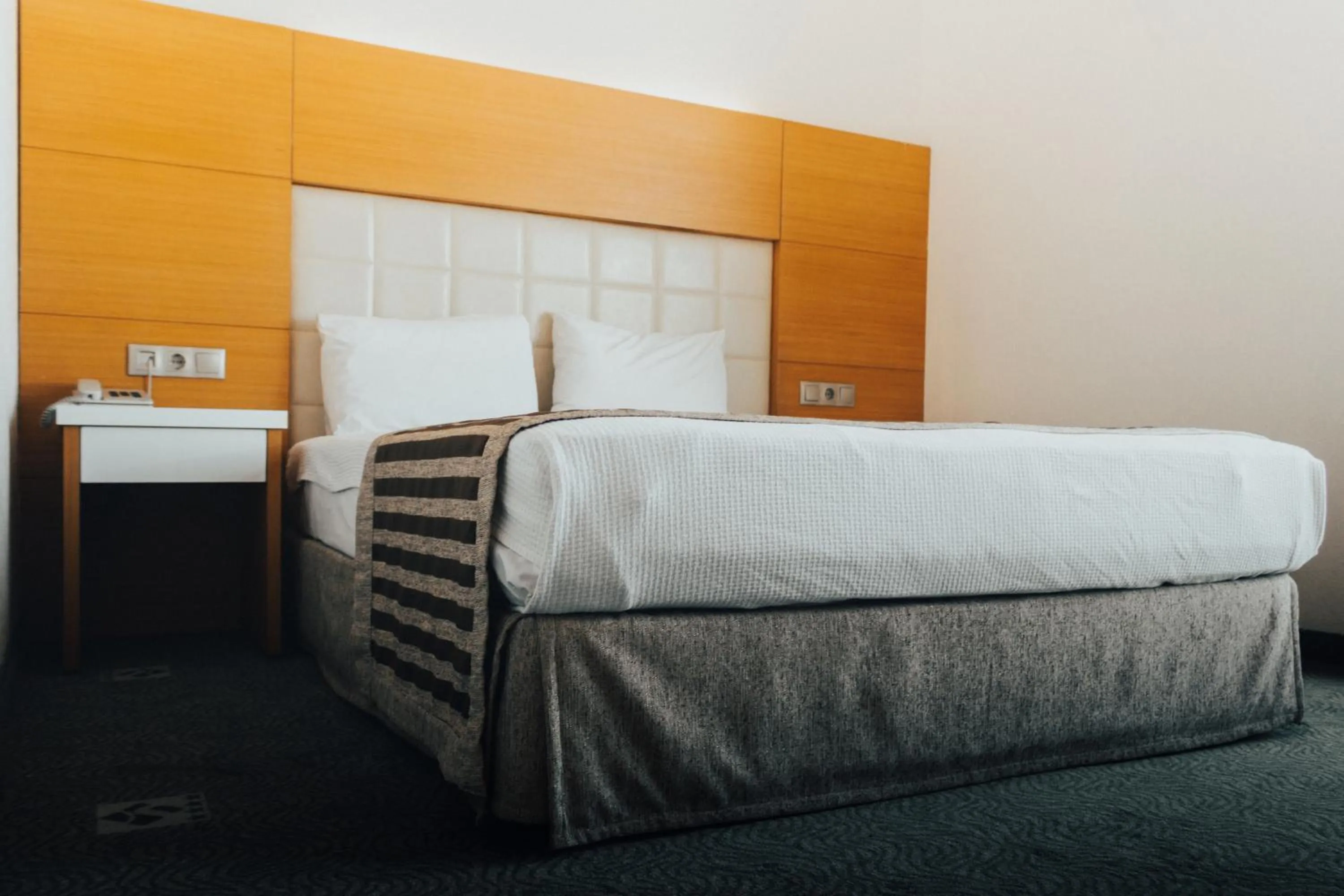 Bed in Nüzhet Hotel