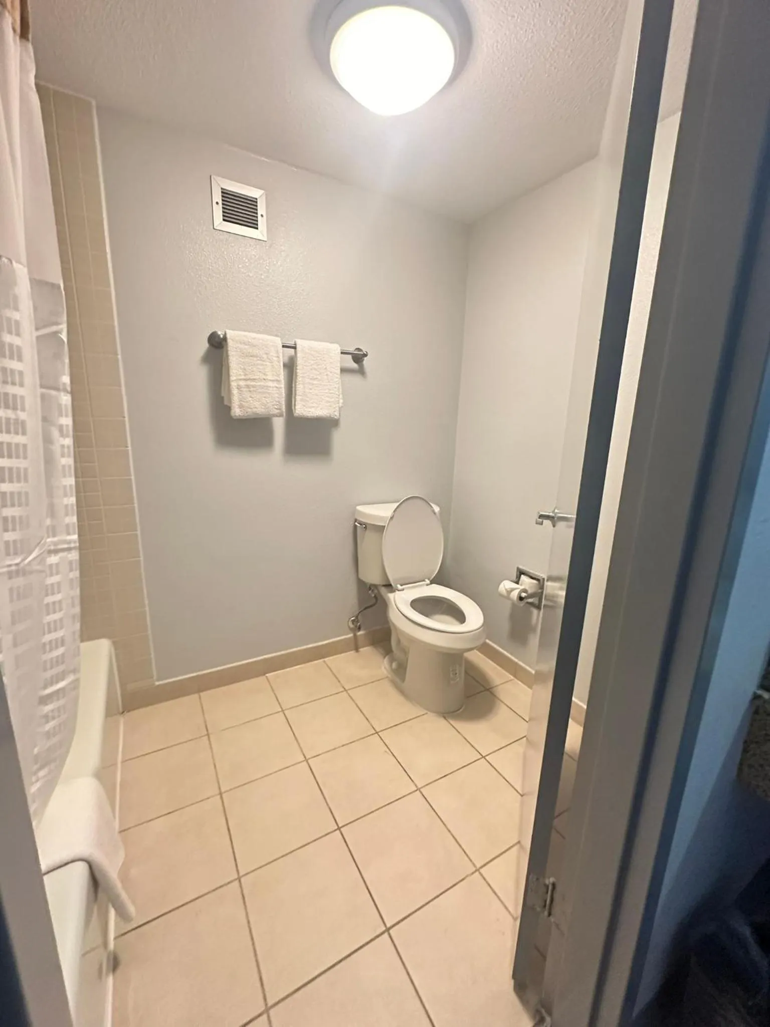 Bathroom in Super 8 by Wyndham Dallas Love Field Airport