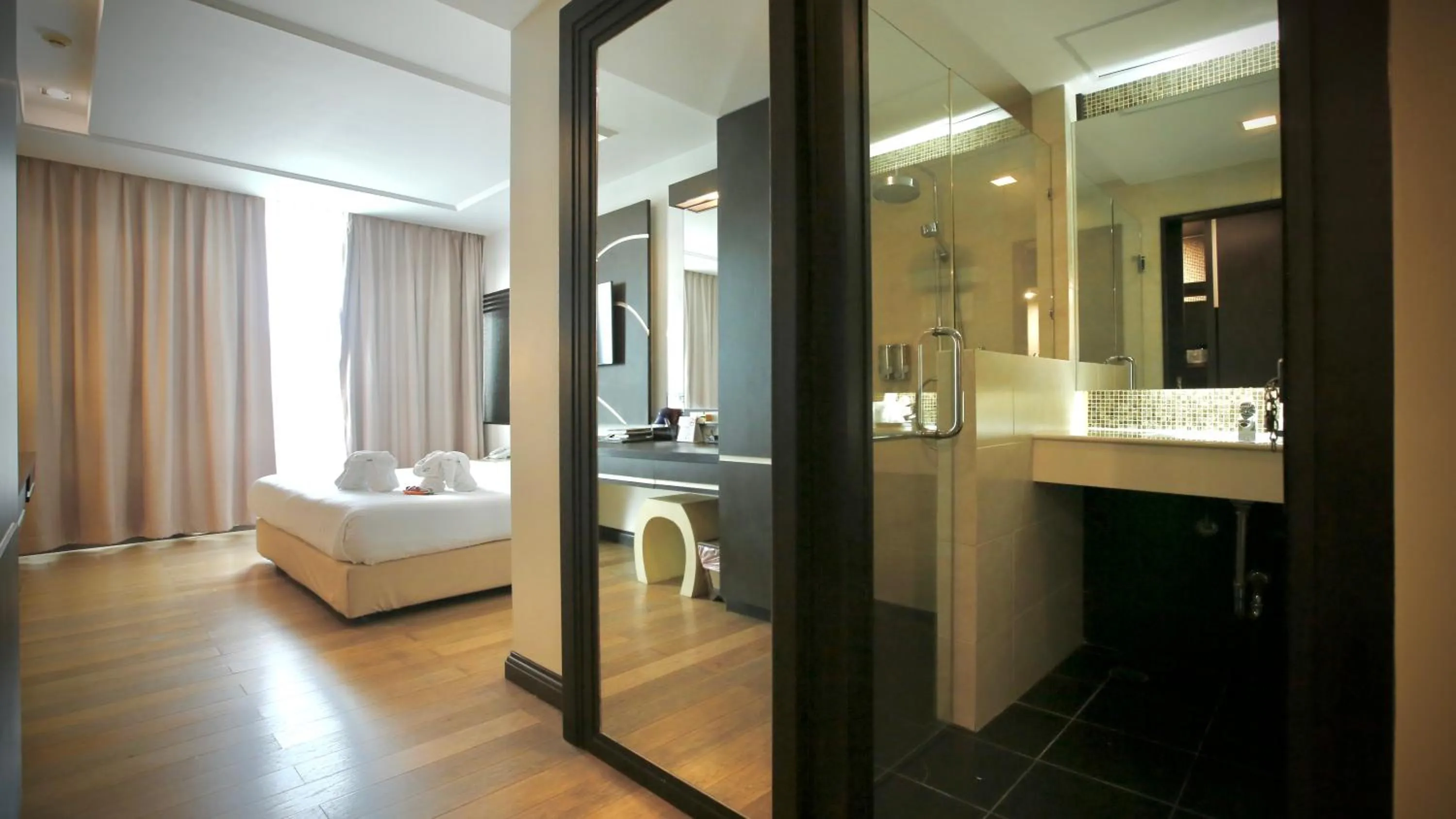 Photo of the whole room, Bed in A-Te Chumphon Hotel - SHA Plus