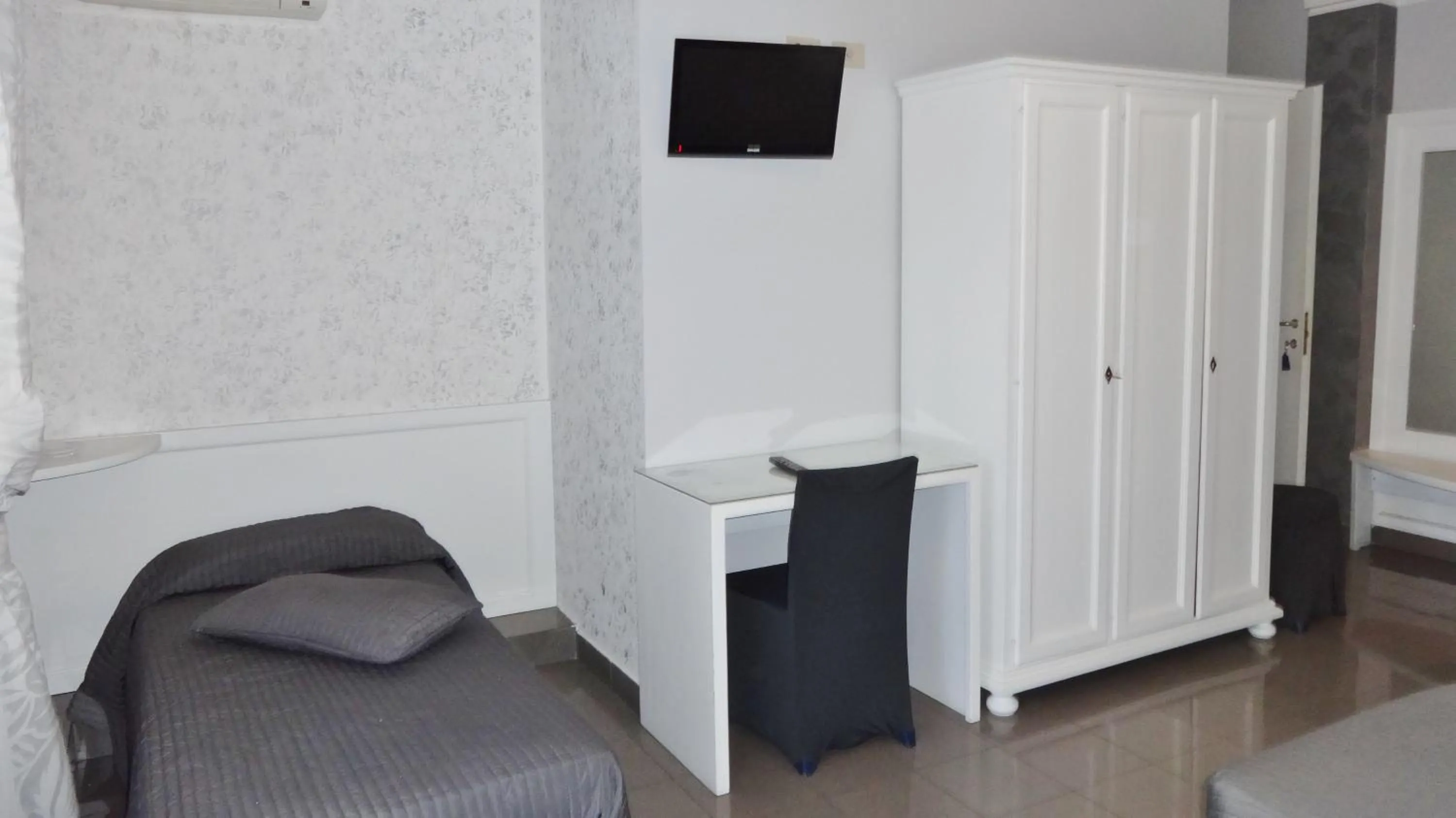 Photo of the whole room, TV/Entertainment Center in Hotel Marte