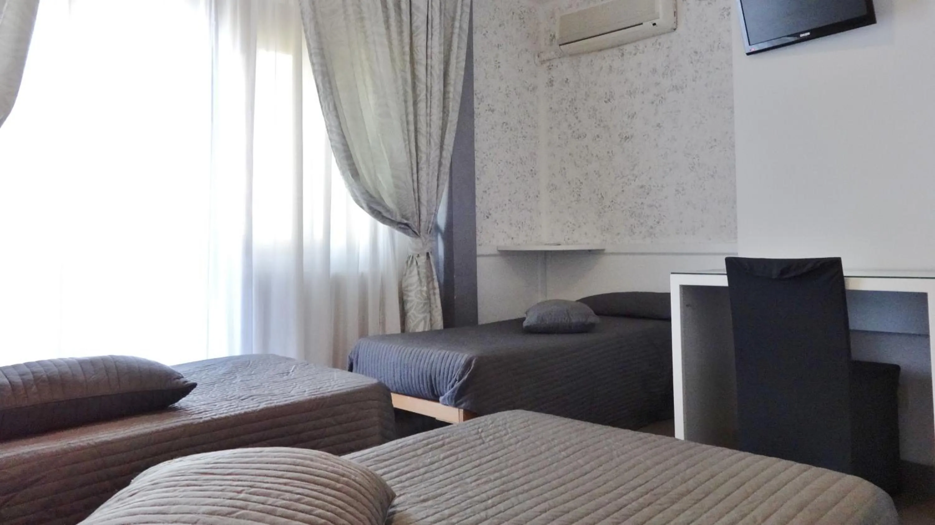 Bed, Seating Area in Hotel Marte