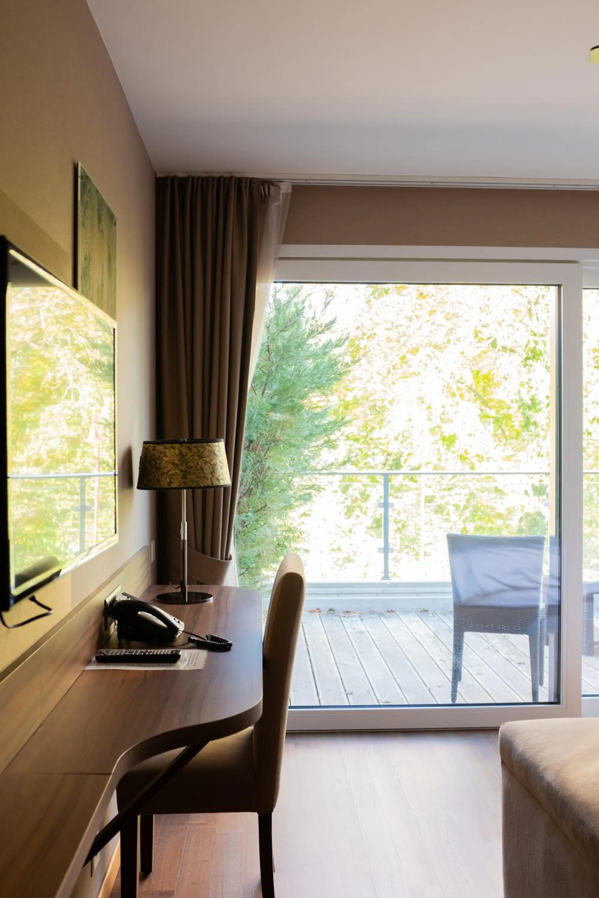 Communal lounge/ TV room in Baron Tavernier Hotel Restaurant & SPA