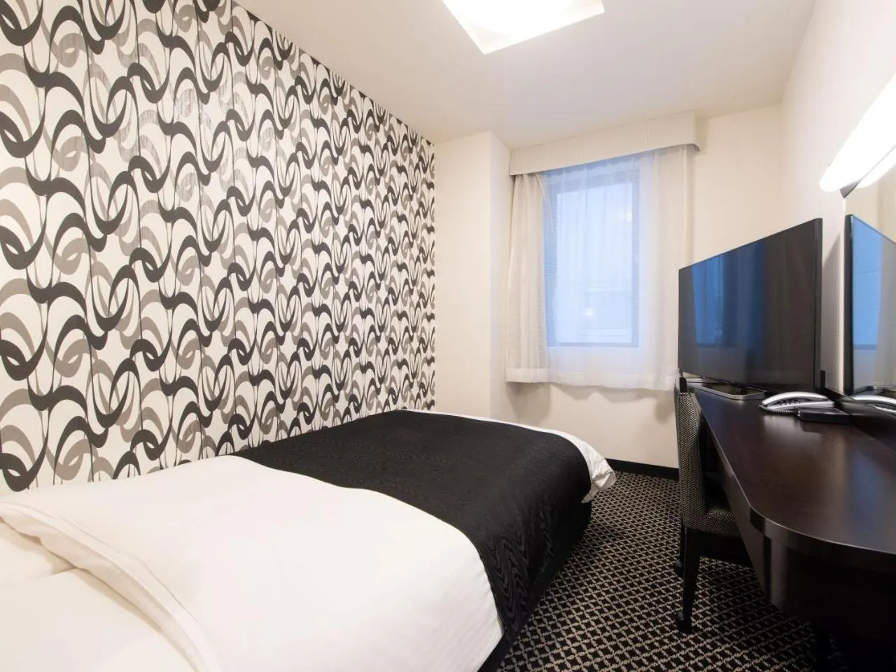 Bed in APA Hotel TKP Tokyo Nishi-Kasai