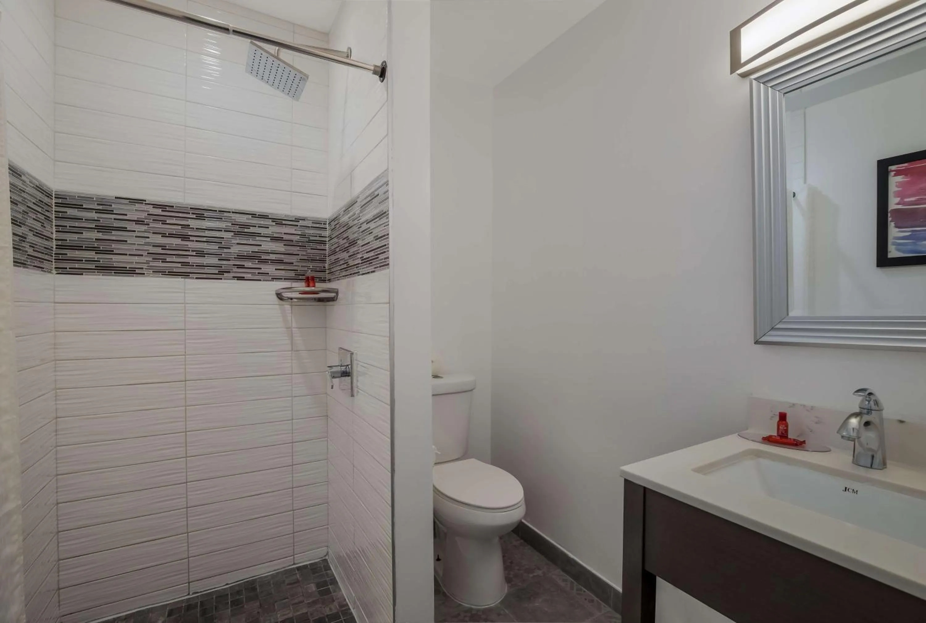 Bathroom in Sunset West Hotel, SureStay Collection By Best Western