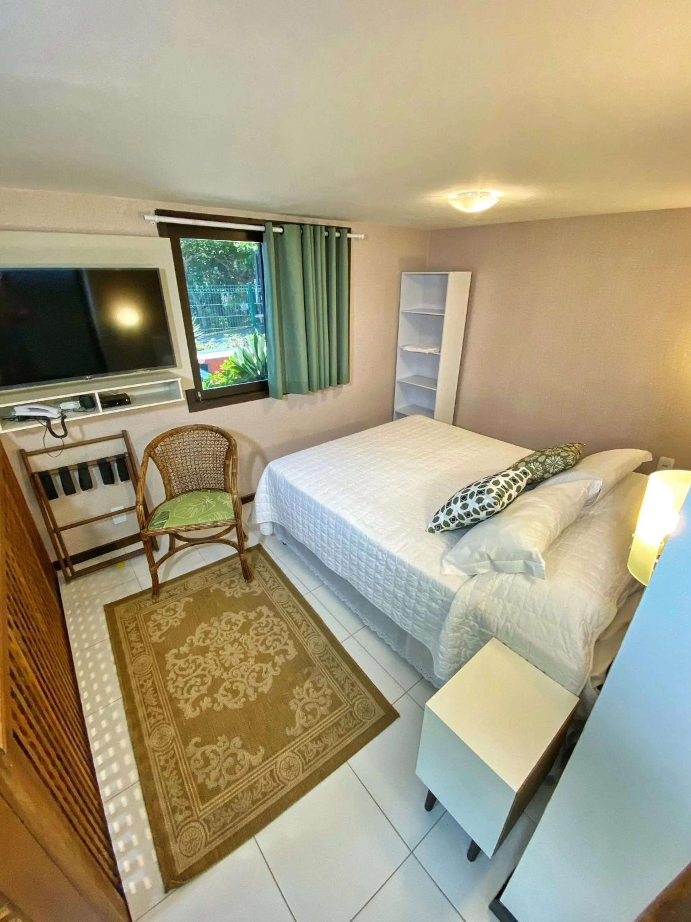 Bed in Pousada Palmeiras