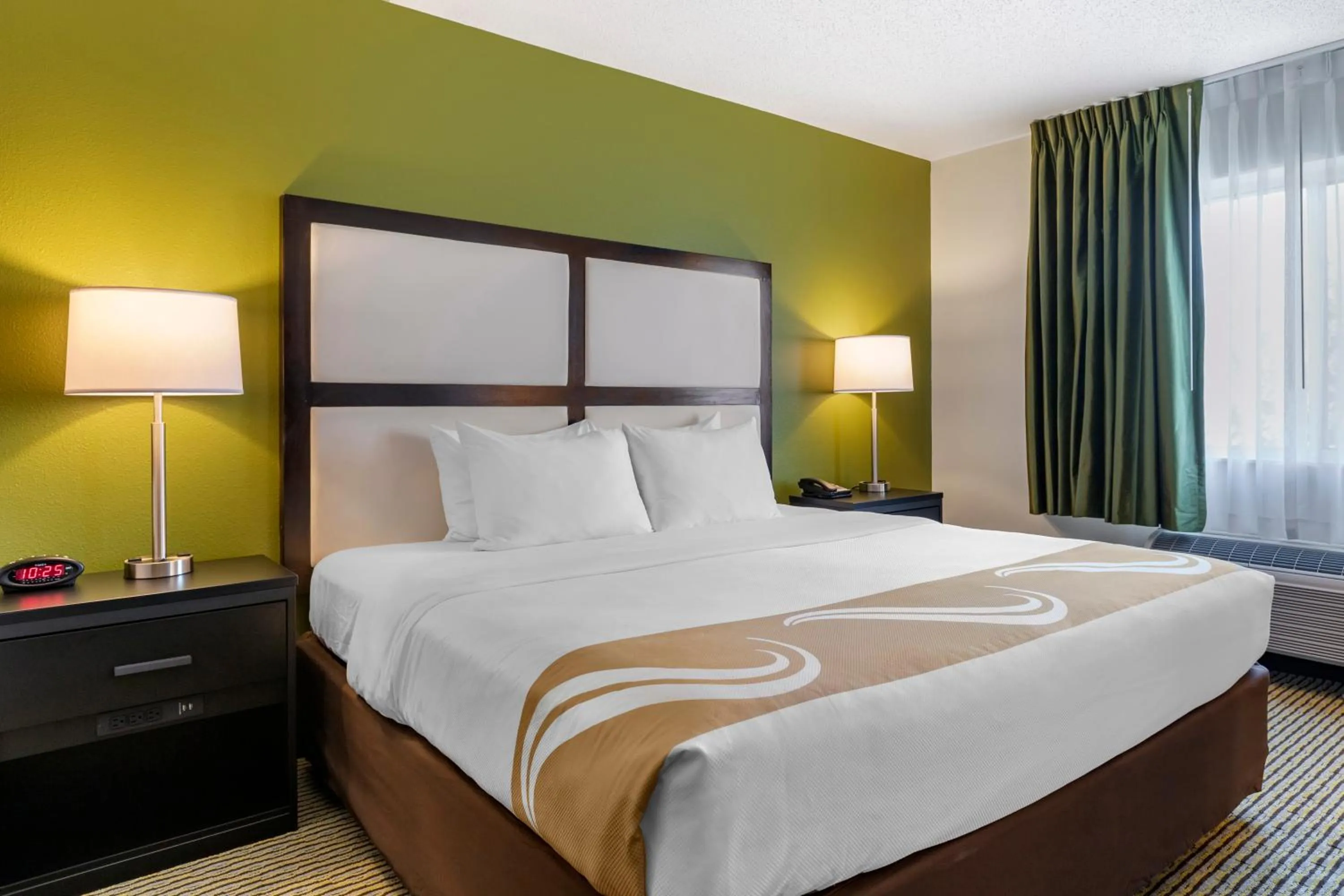 Bed in Quality Inn & Suites