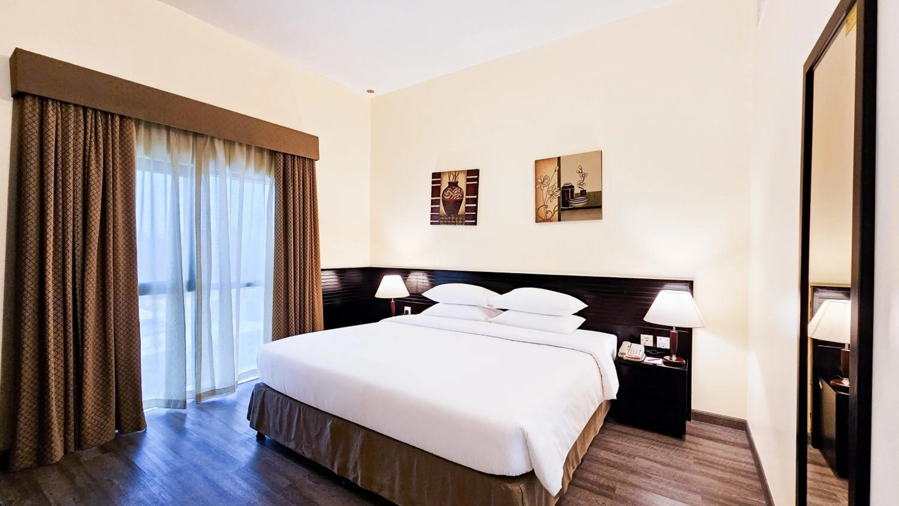 Bed in Ramada Hotel & Suites by Wyndham Ajman