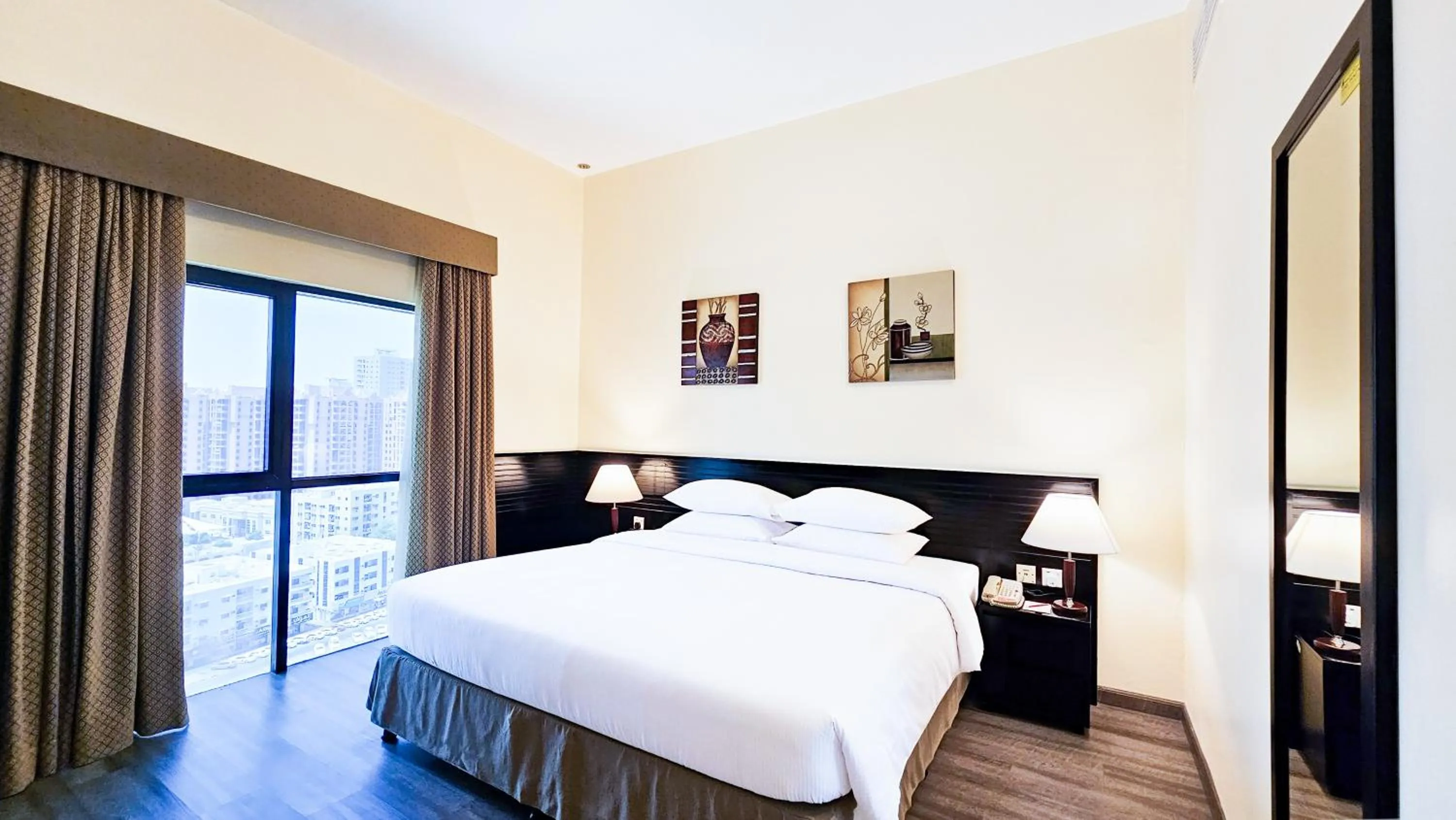 Bed in Ramada Hotel & Suites by Wyndham Ajman