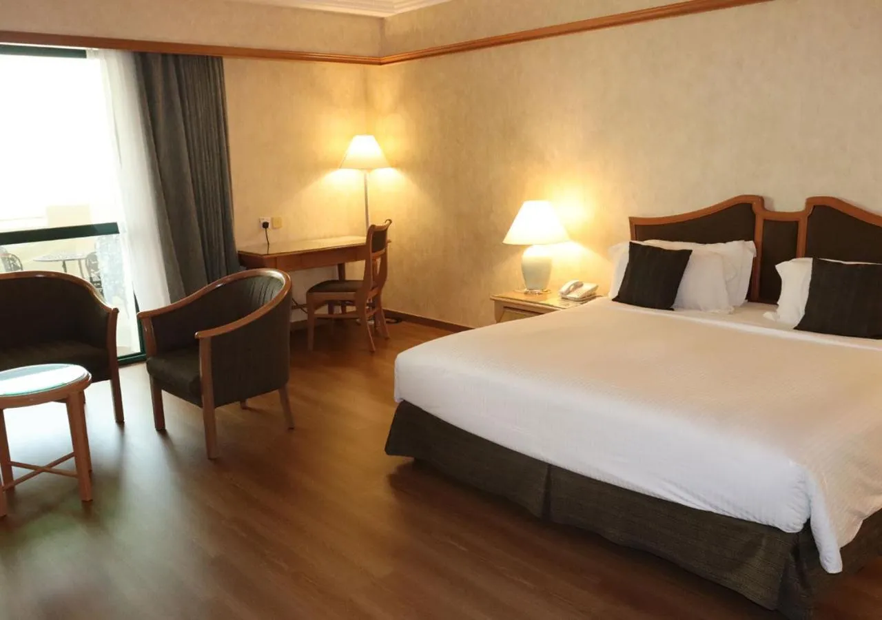 Bed in Grand Palace Hotel