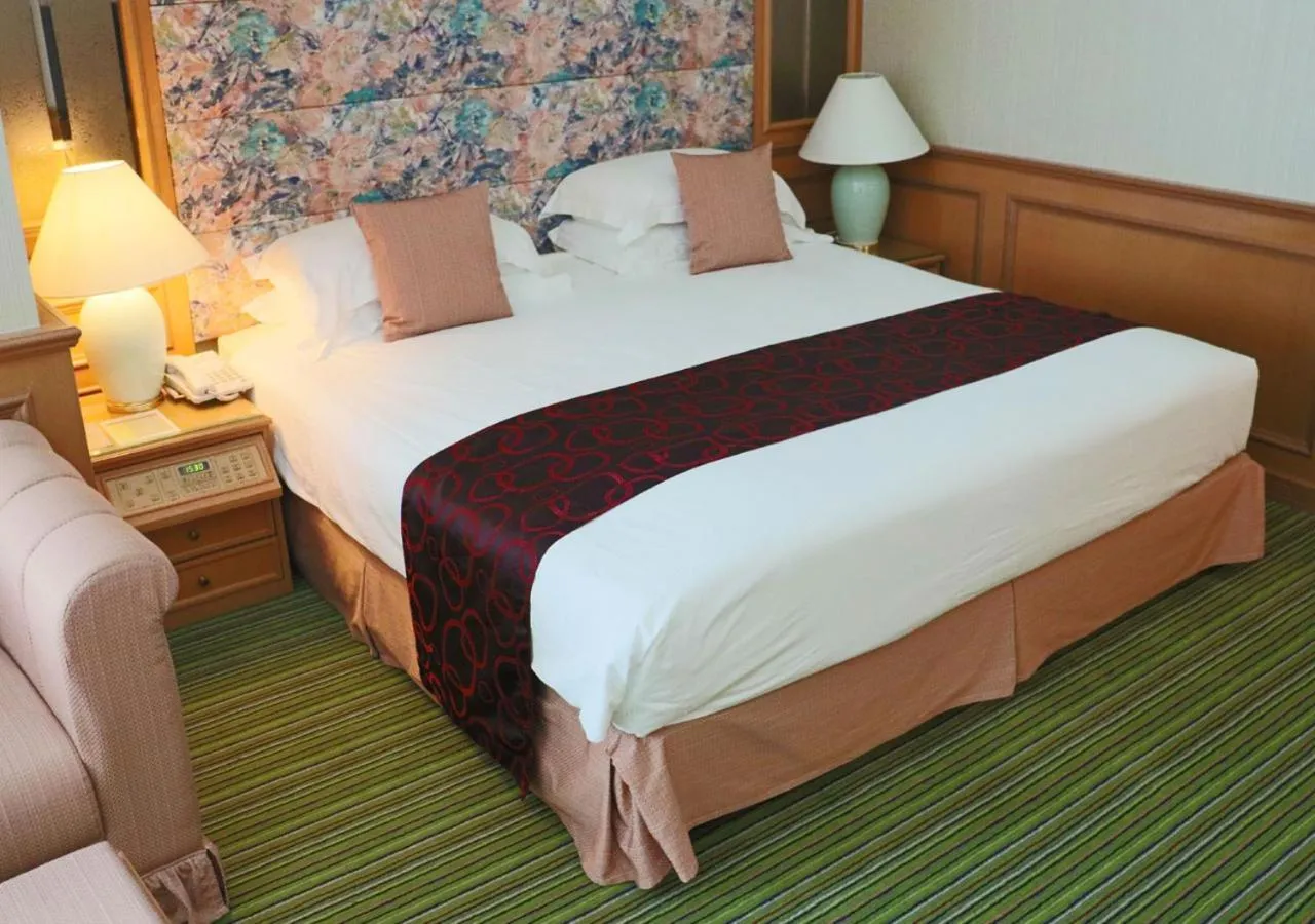 Bed in Grand Palace Hotel