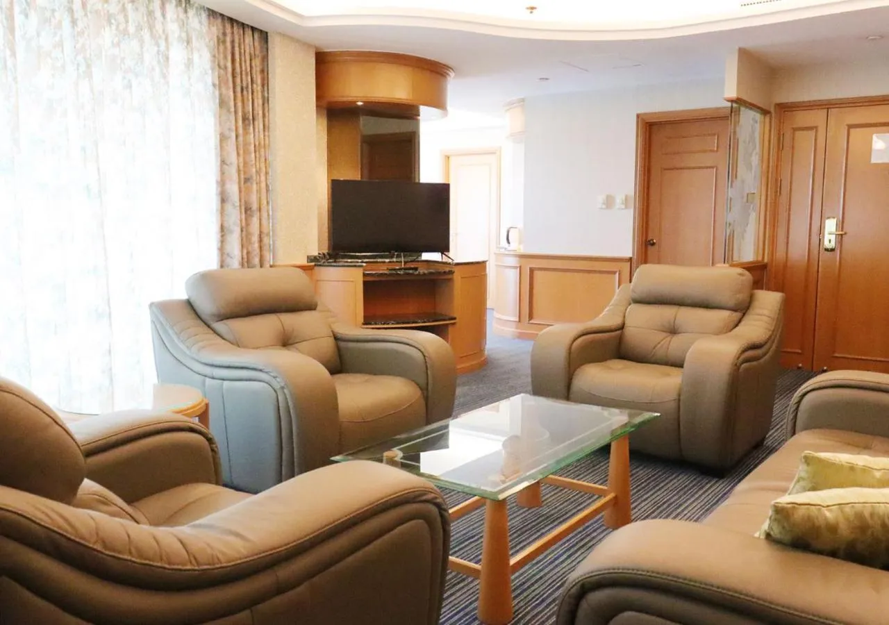 Communal lounge/ TV room in Grand Palace Hotel