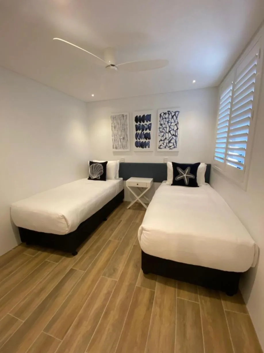 Bed in Bay Royal Apartments