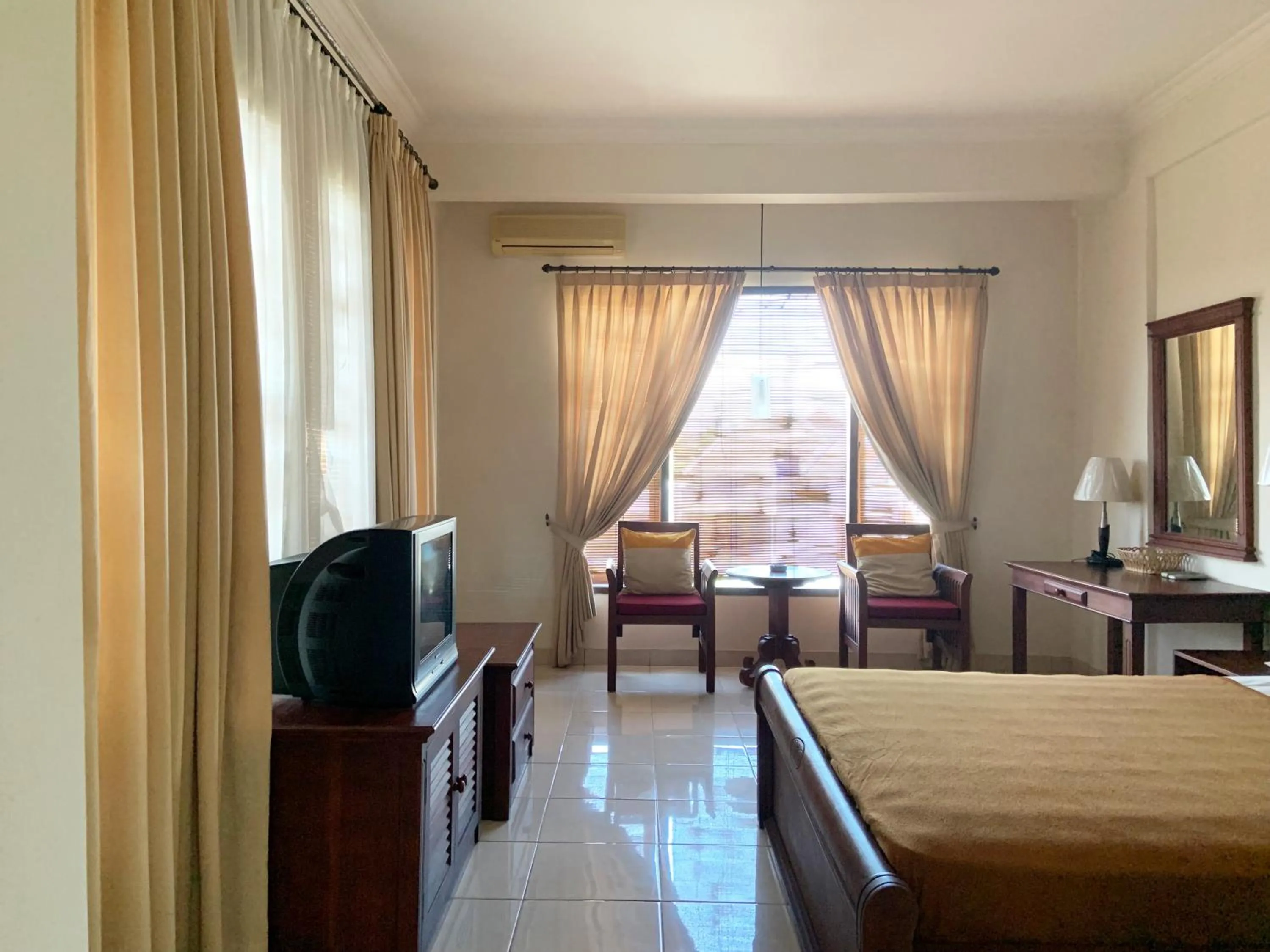 Photo of the whole room, Bed in Nirwana Suites