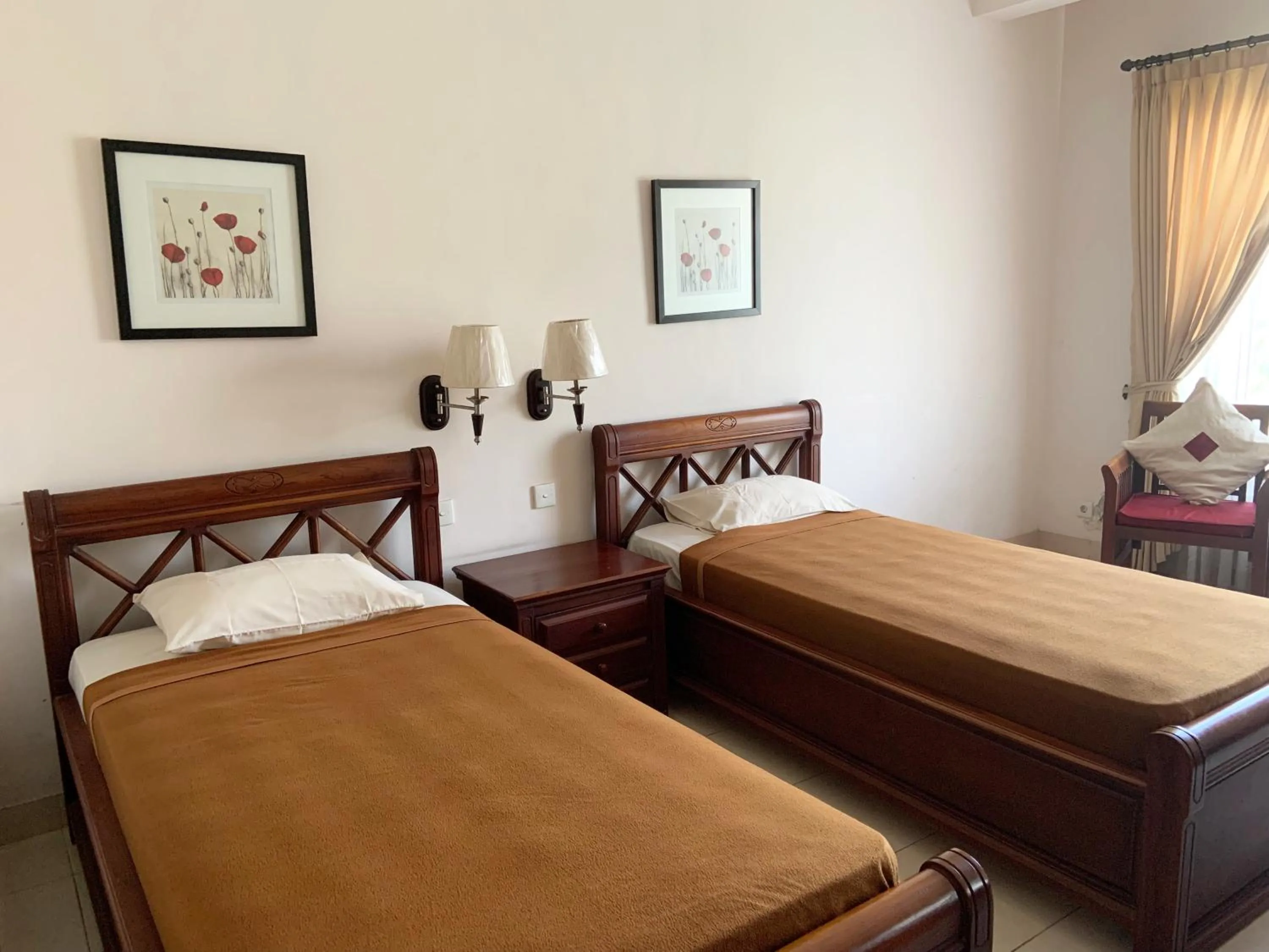 Bed in Nirwana Suites