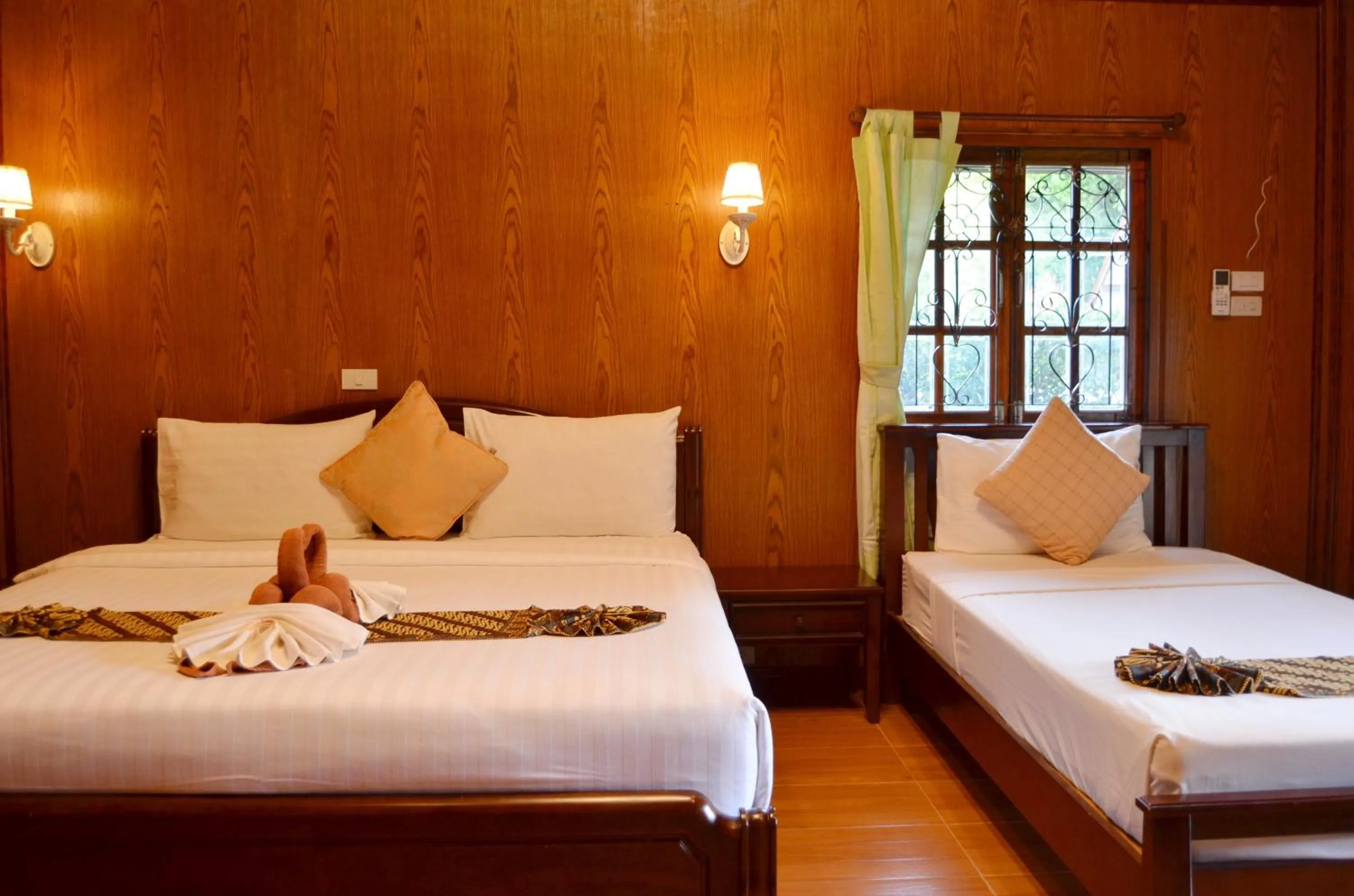 Bed in Sayang Beach Resort Koh Lanta