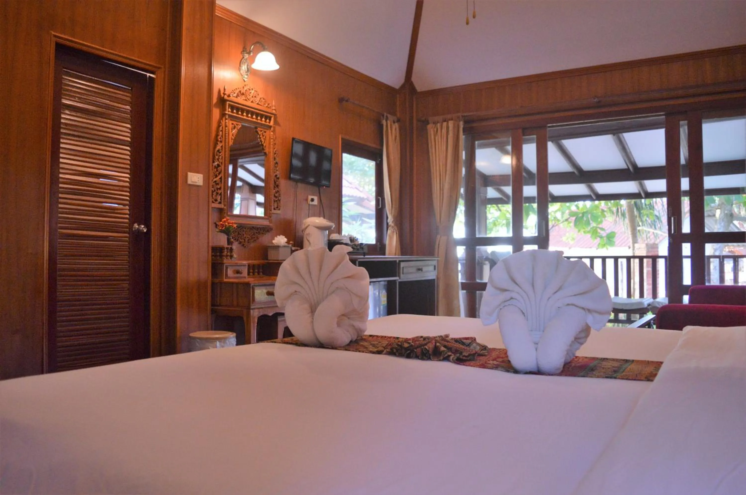 Photo of the whole room, Bed in Sayang Beach Resort Koh Lanta