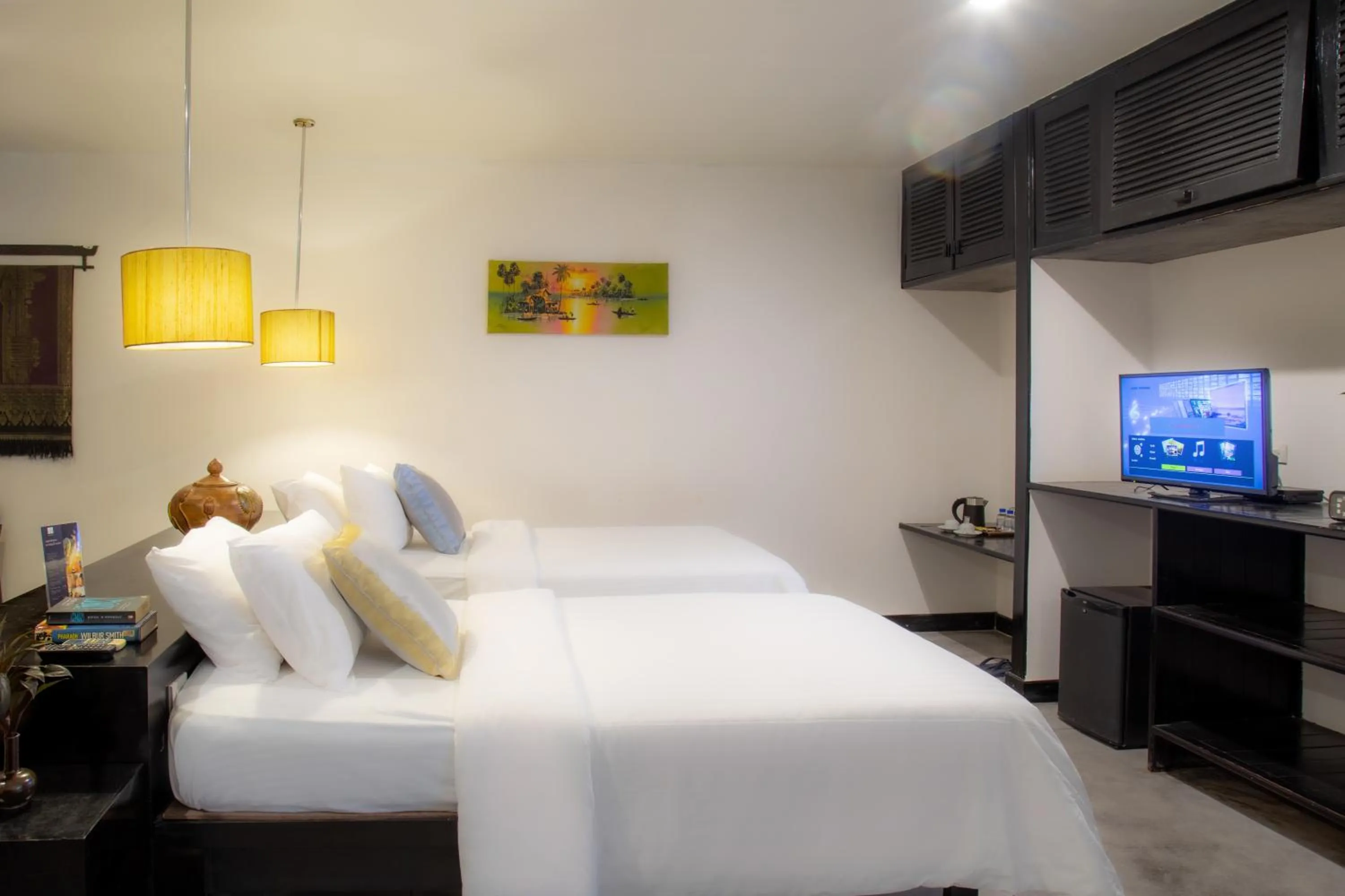 Communal lounge/ TV room, Bed in Bunwin Siem Reap