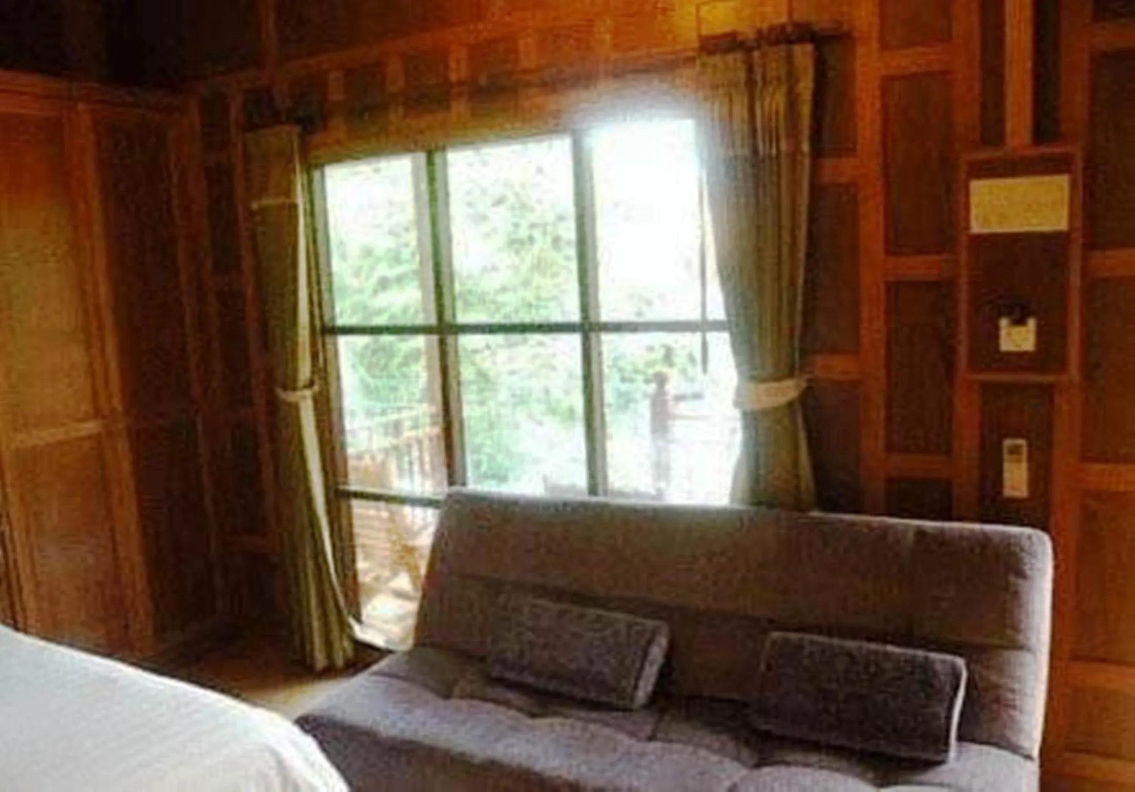 Seating area, Bed in JJ Bungalow