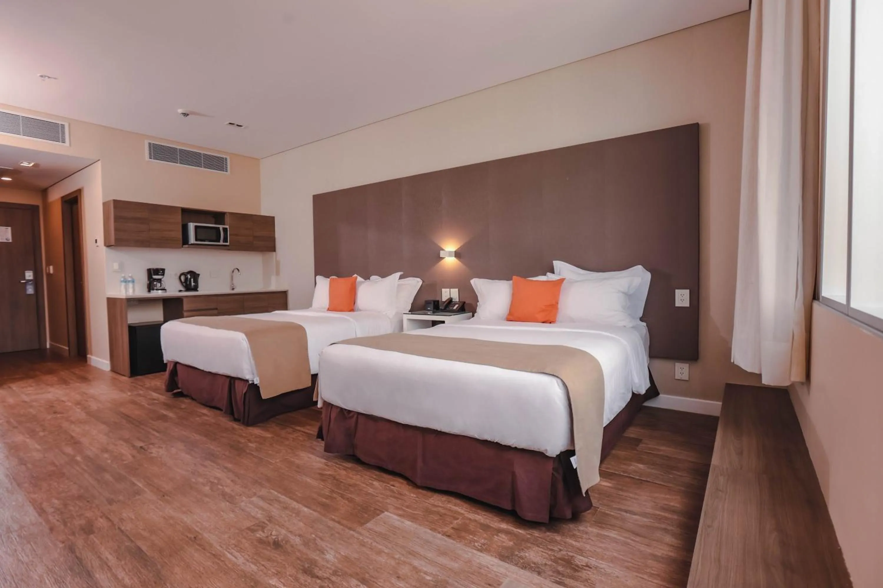 Bed in Paseo La Galería Hotel & Suites