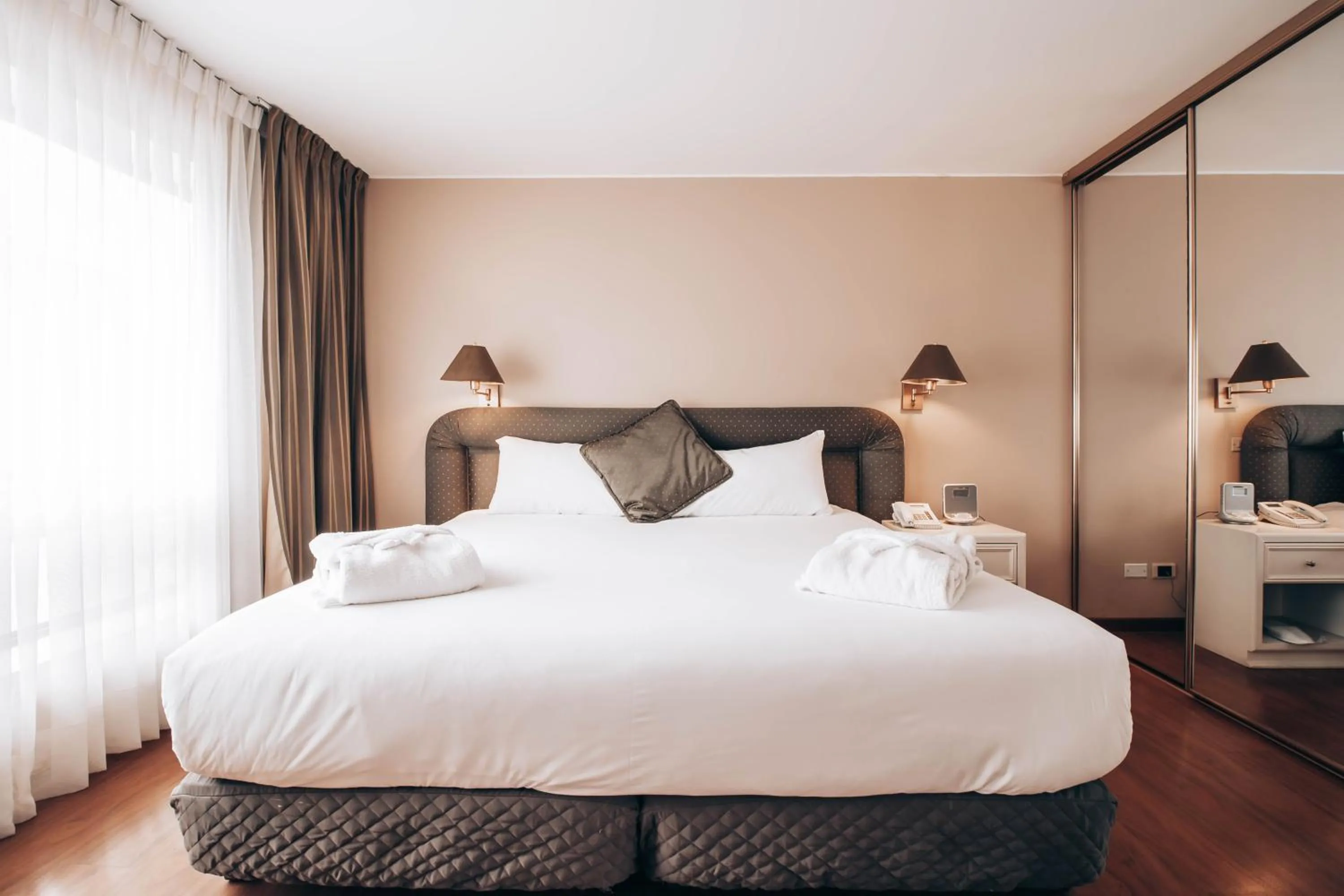 Bed in Suites del Bosque Hotel