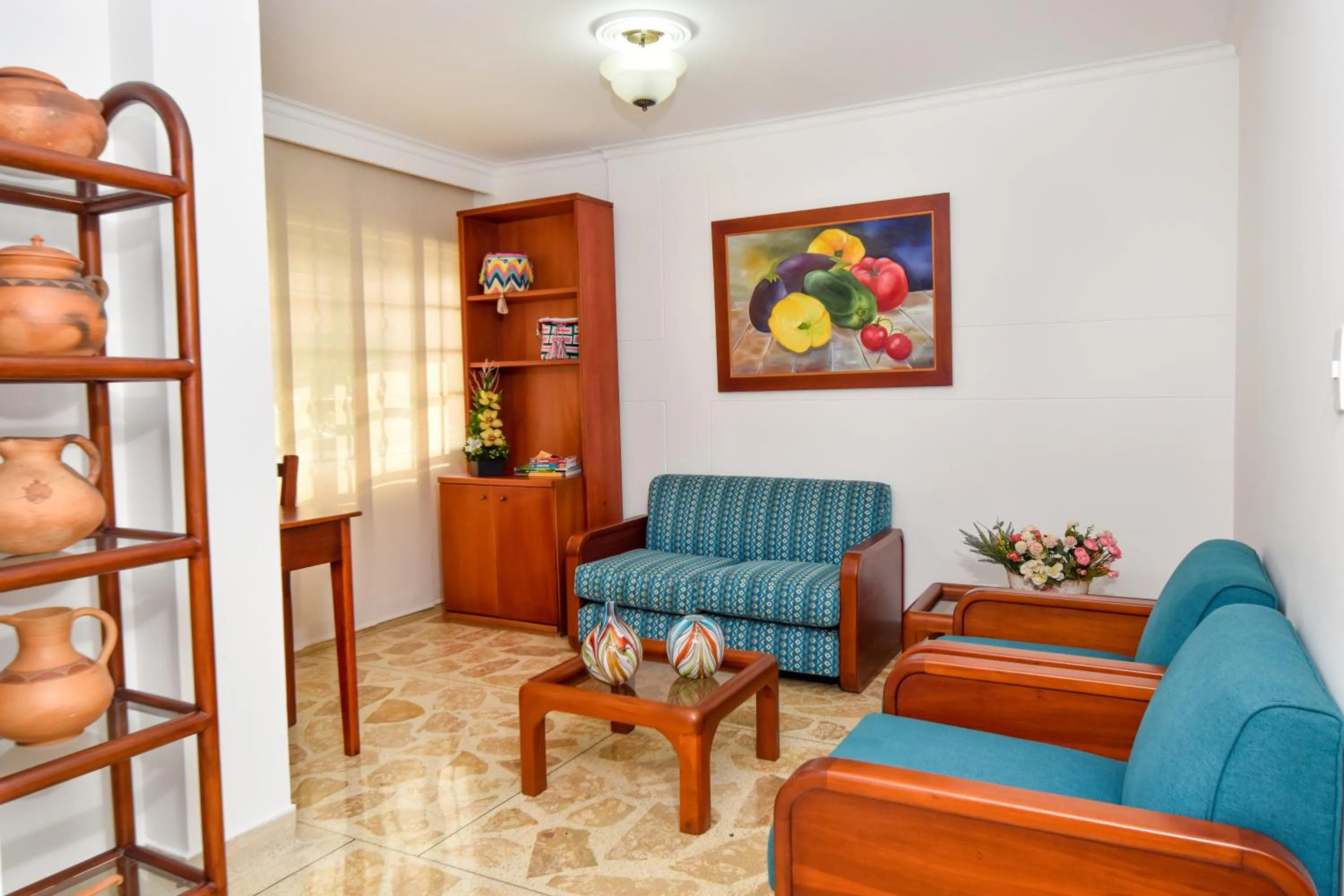 Communal lounge/ TV room in La Campana Hotel Boutique