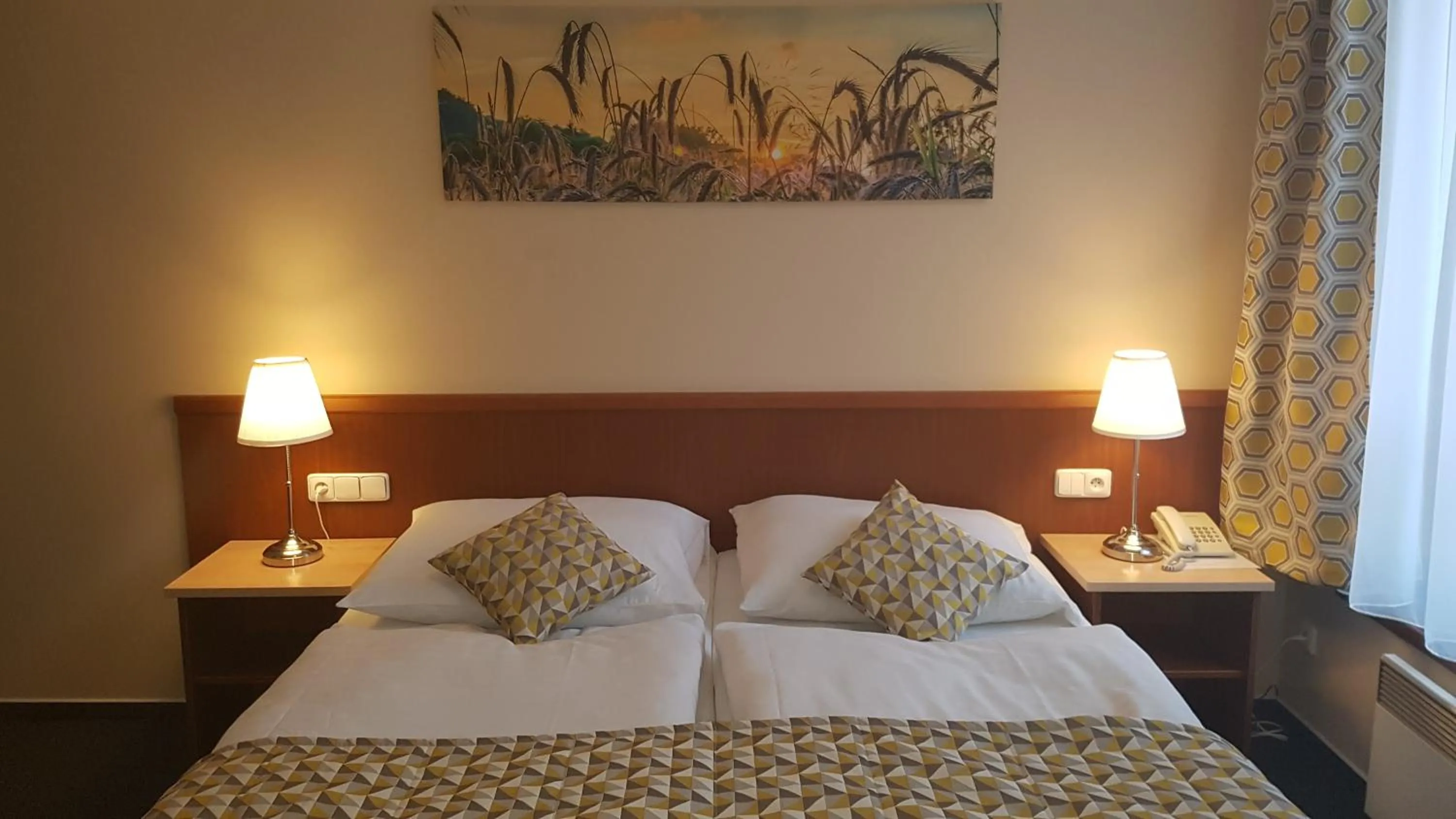 Bed in Aparthotel Austria Suites