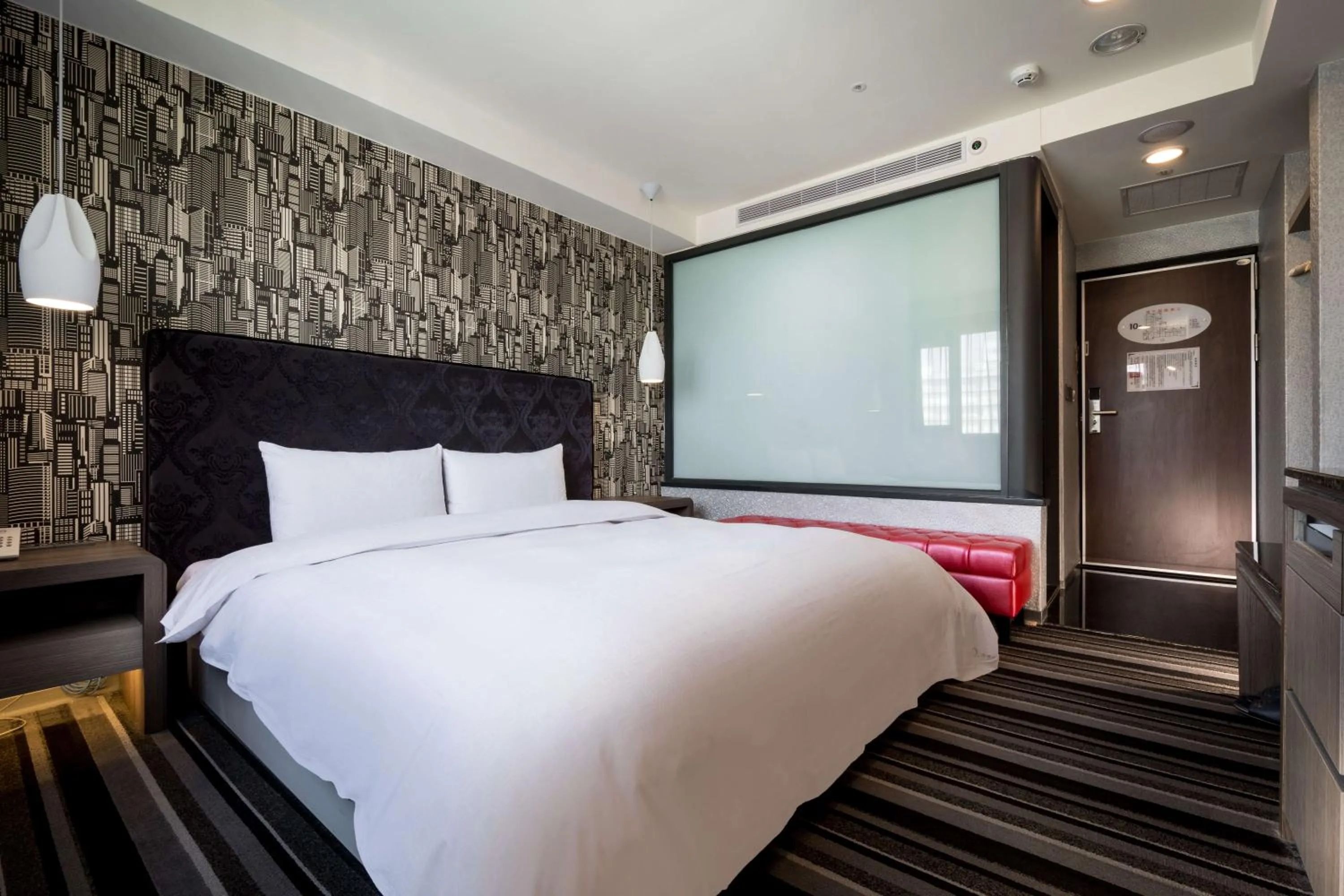 Bed in JUNG-ZAW BUSSINESS HOTEL