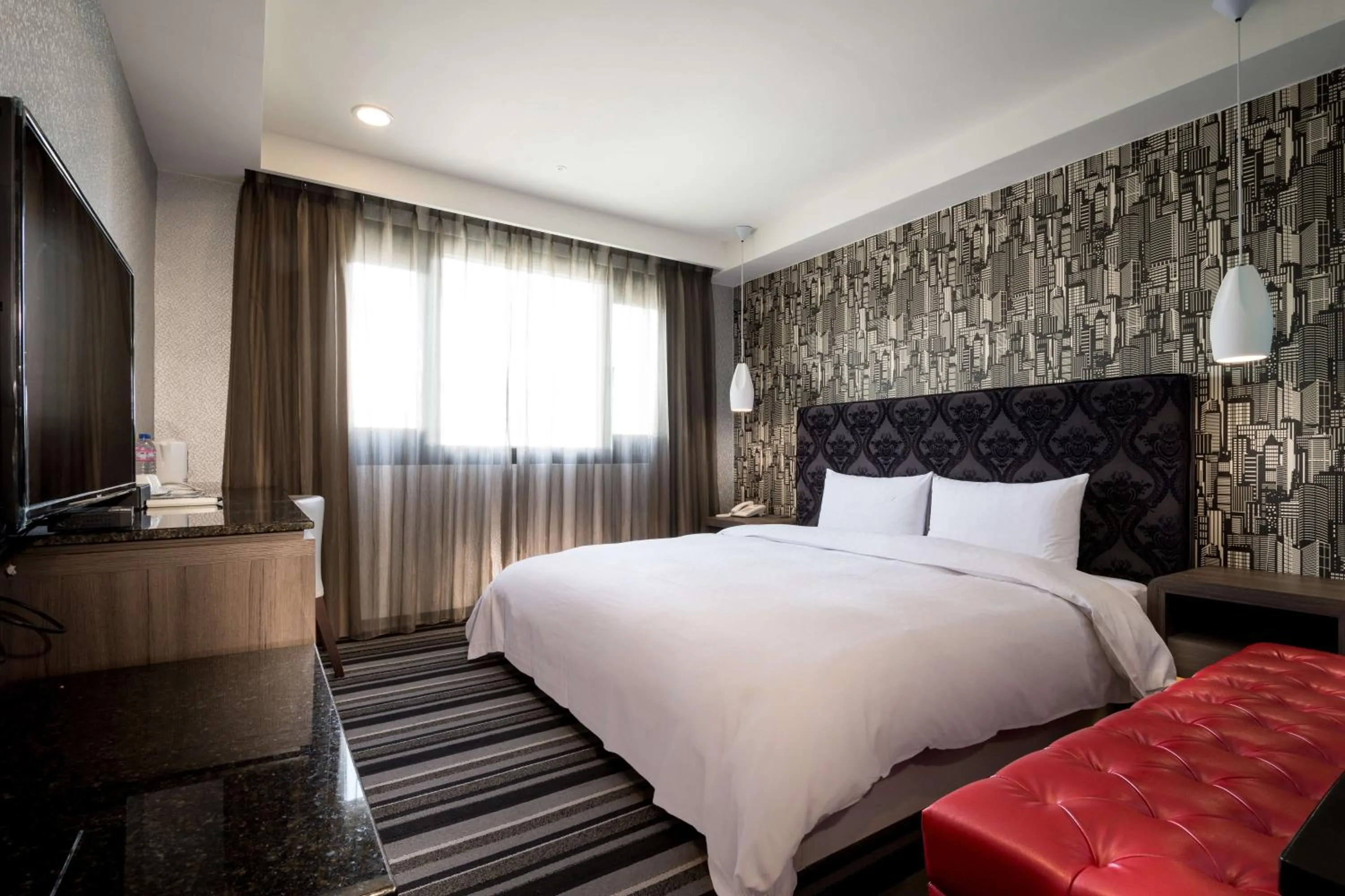 Bed in JUNG-ZAW BUSSINESS HOTEL