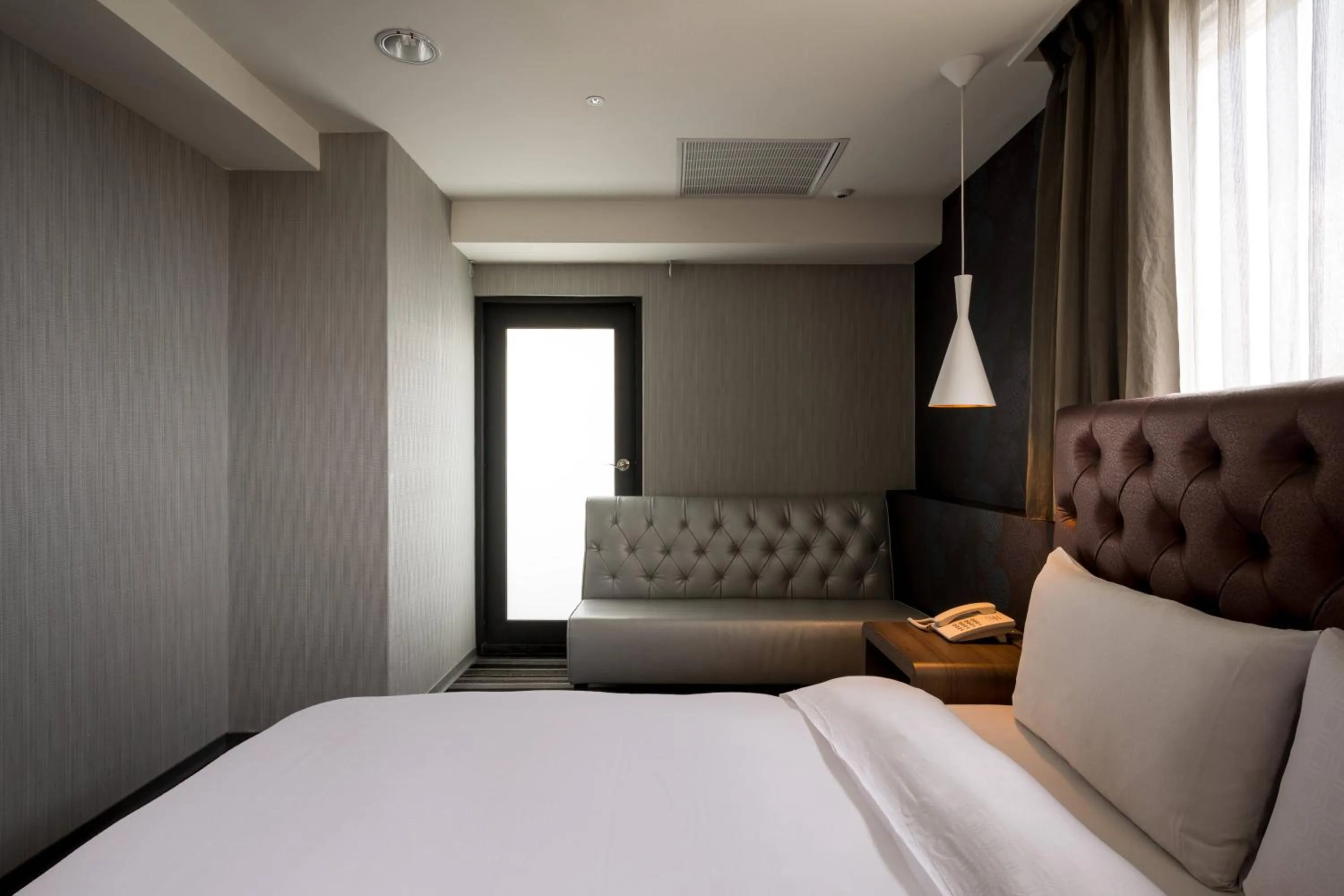 Bed in JUNG-ZAW BUSSINESS HOTEL