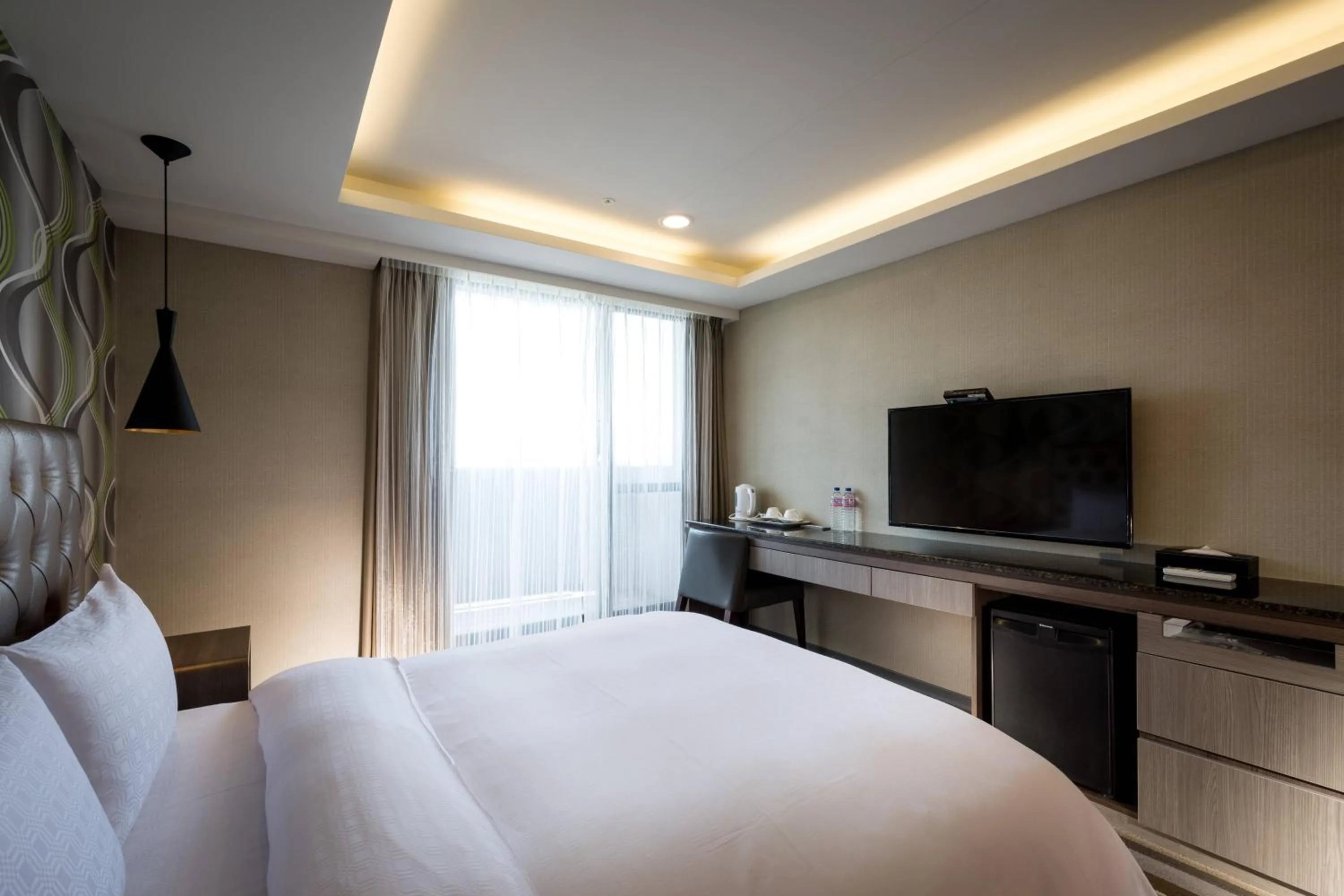 Bed in JUNG-ZAW BUSSINESS HOTEL