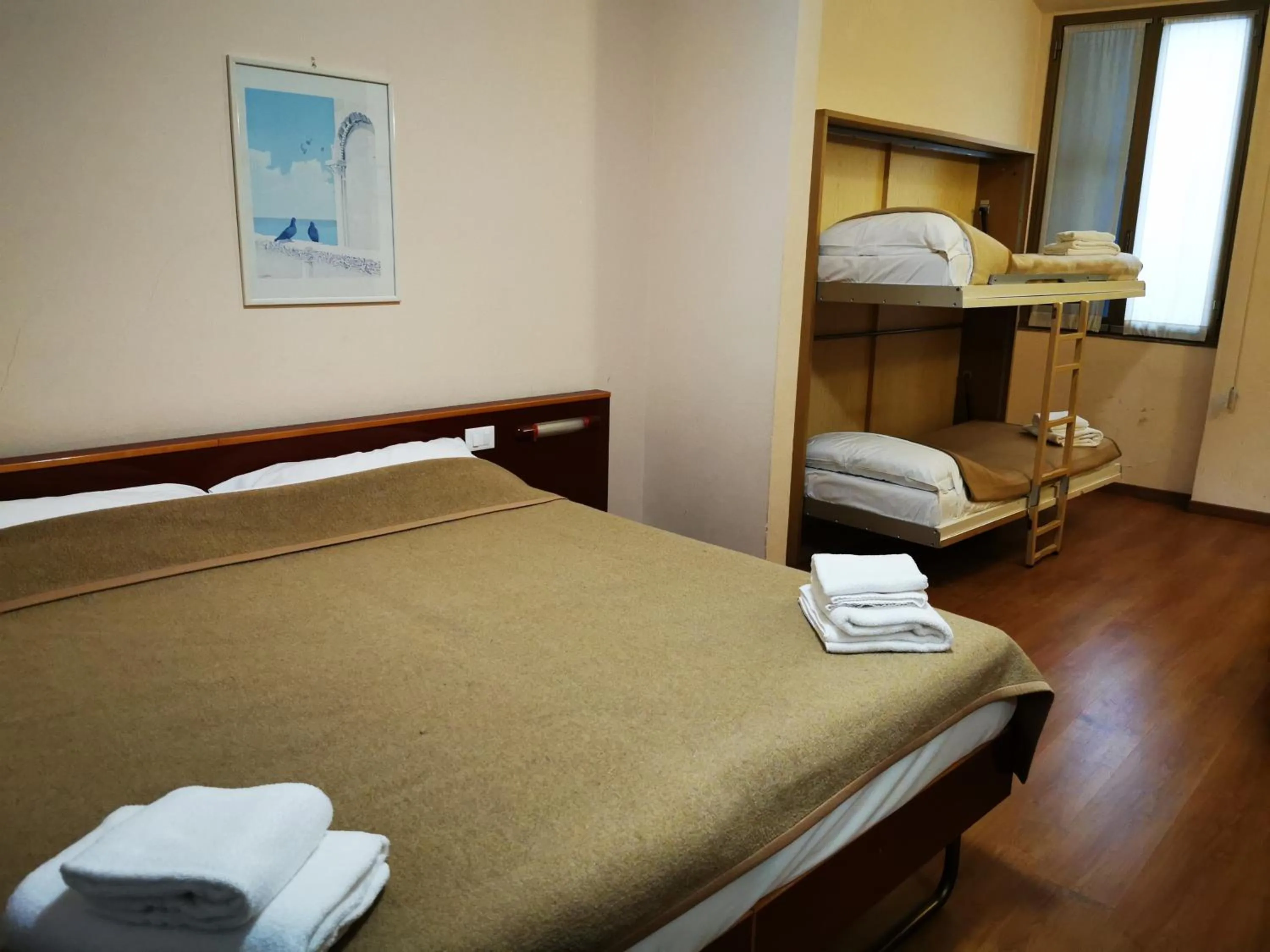 Bed in New Alexander Hotel