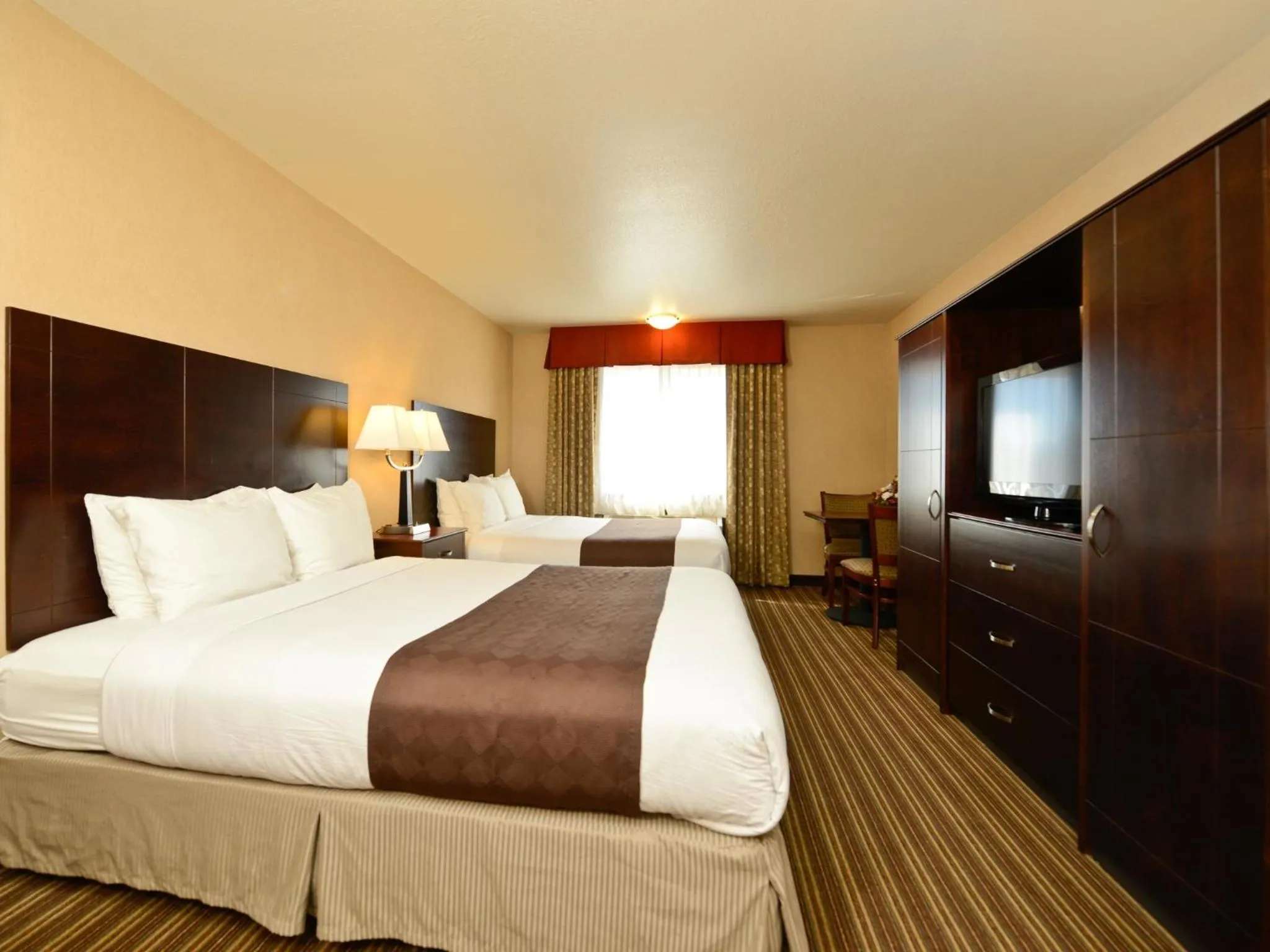 Bed in Yellowstone West Gate Hotel