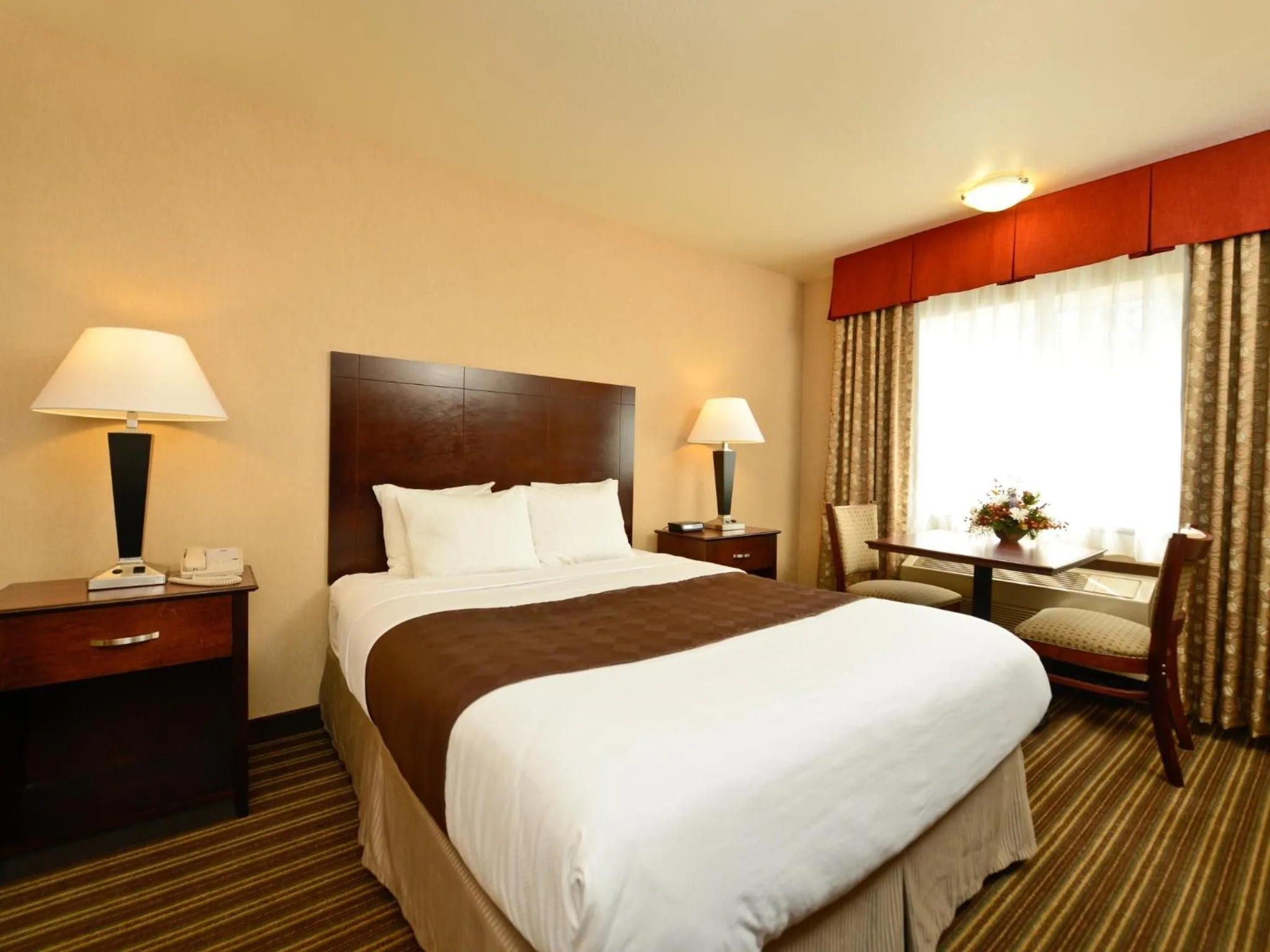 Bed in Yellowstone West Gate Hotel