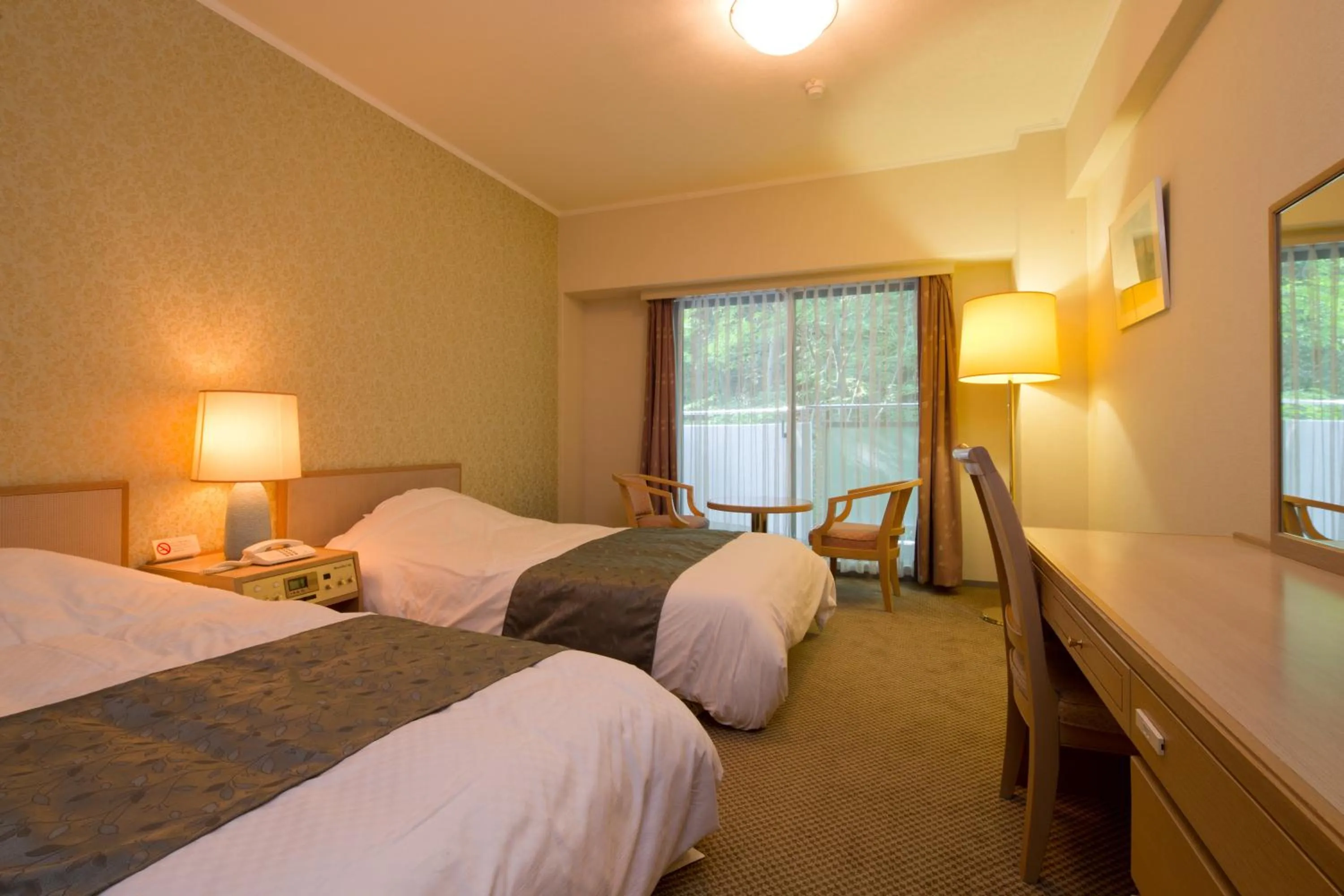 Photo of the whole room, Bed in Merveille Arima