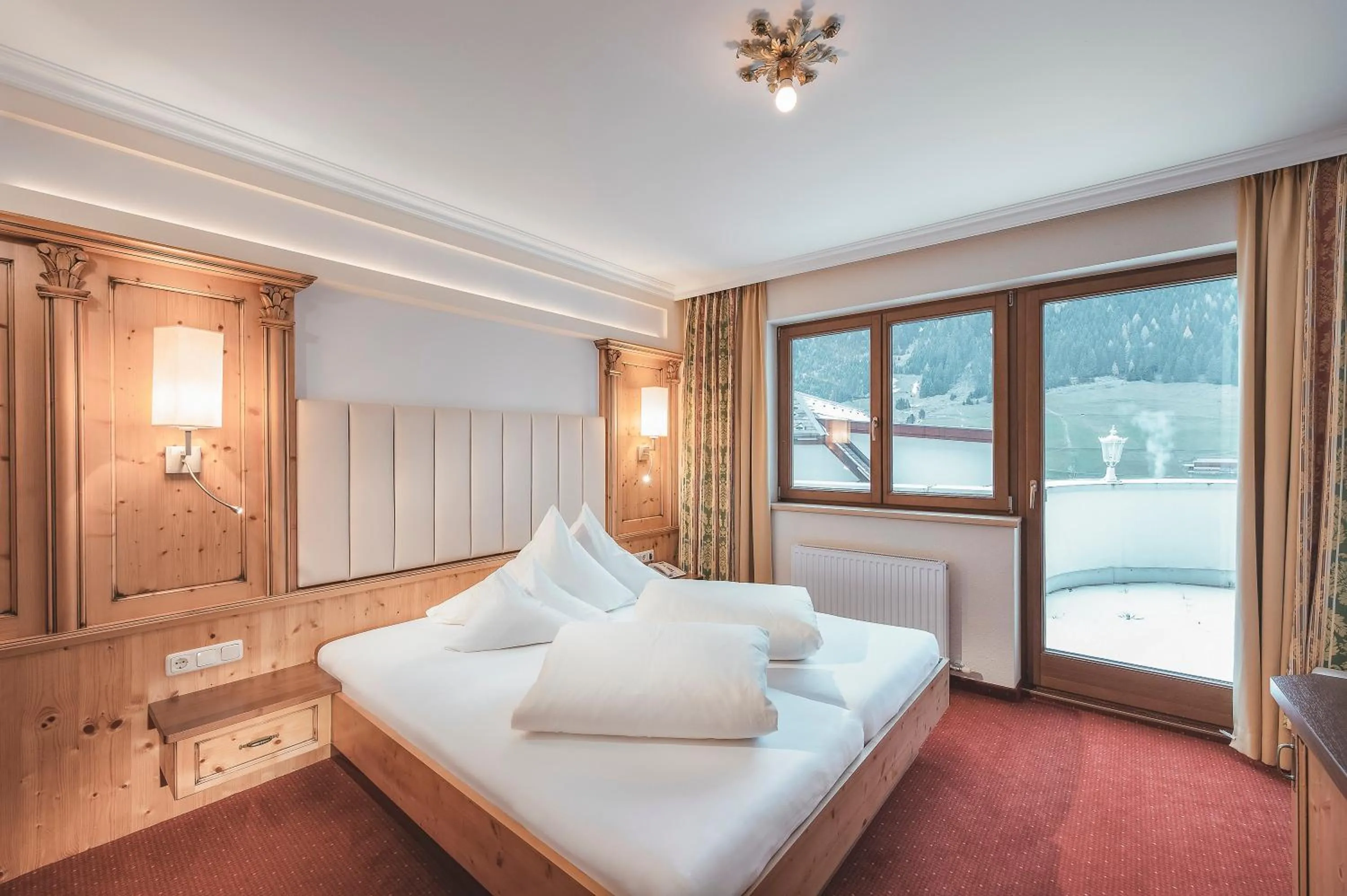 Photo of the whole room, Bed in Alpvita Piz Tasna